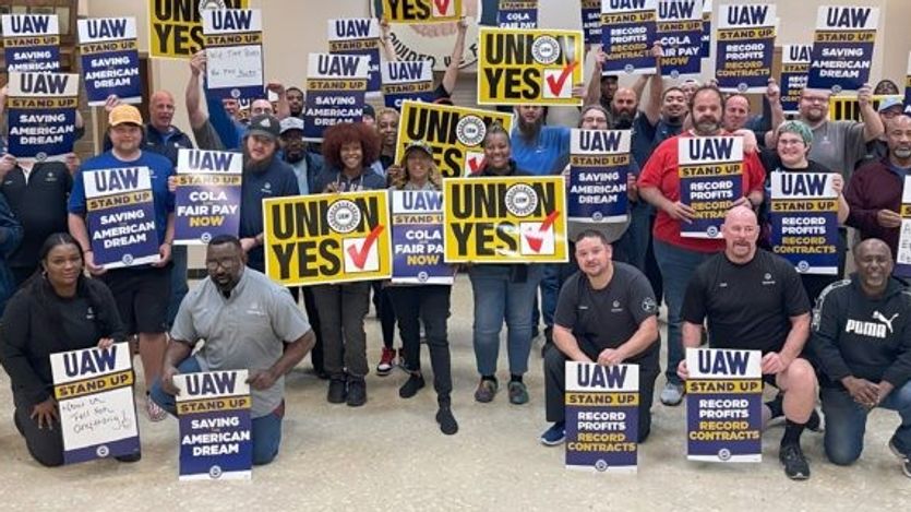Workers with UAW signs.
