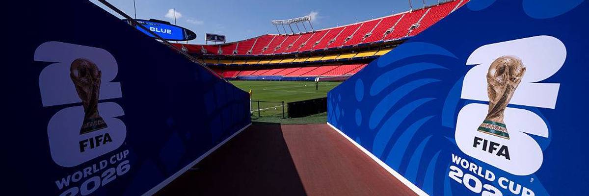 World Cup signage leading on to a field.