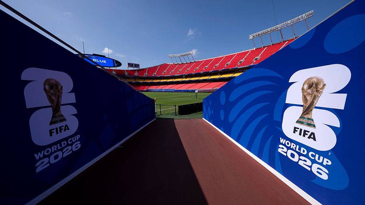 World Cup signage leading on to a field.