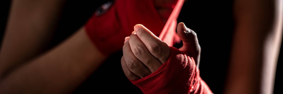 Wrapping hands before boxing match