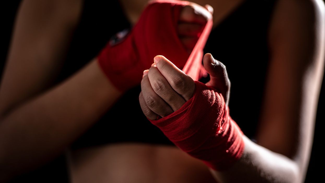Wrapping hands before boxing match