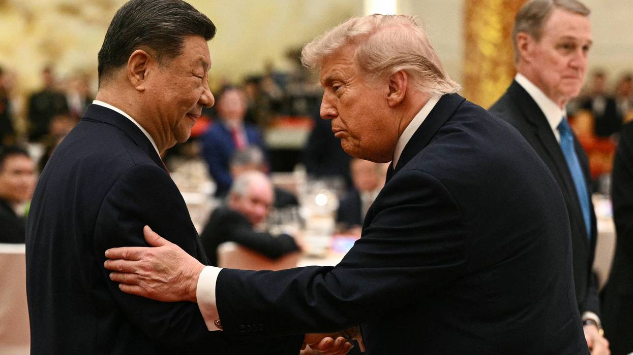 Xi and Trump face each other.