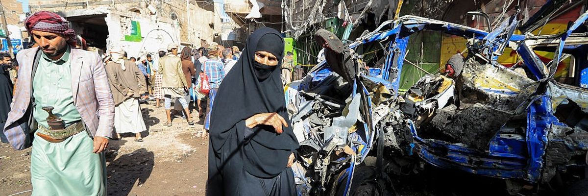 Yemenis assess the damage cause by a U.S. airstrike