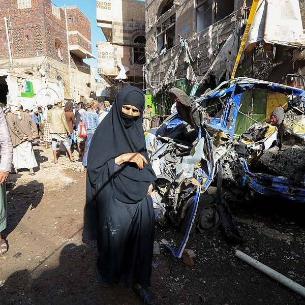 Yemenis inspect damage caused by a US airstrike on a market in Sanaa
