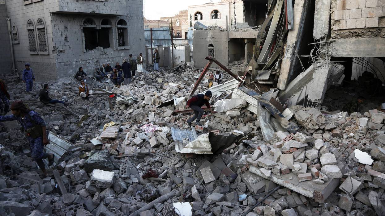 Yemenis inspect the scene of aerial attacks said to be carried out by aircraft of the coalition led by Saudi Arabia on January 18, 2022 in Sana'a, Yemen.