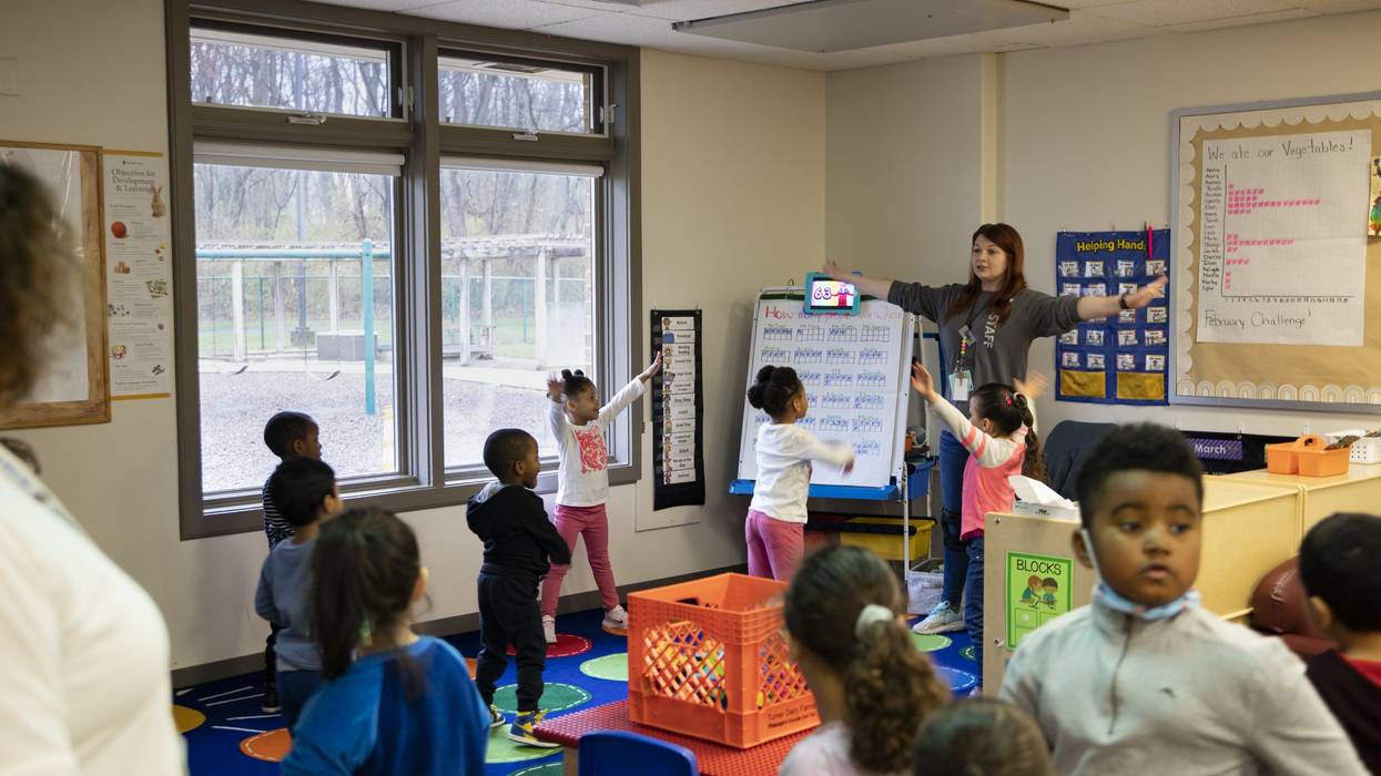 Young children participate in morning warm-up in a Head Start classroom