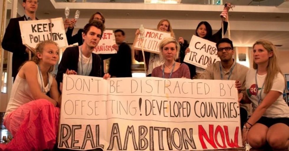 Young climate activists protest carbon markets at the UNFCCC negotiations in Bonn in 2012. (Photo: Young FoEE/flickr/cc)
