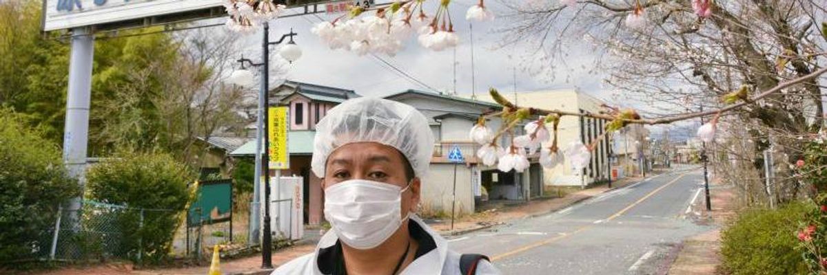 Yuji Onuma pictured in April in the ghost town of Futaba, Fukushima Prefecture.