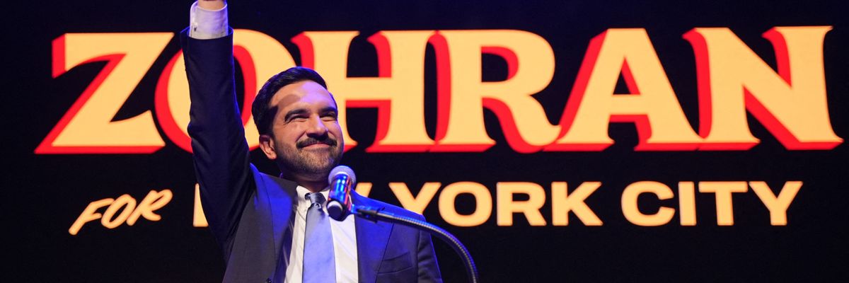 Zohran Mamdani waves to the crowd.