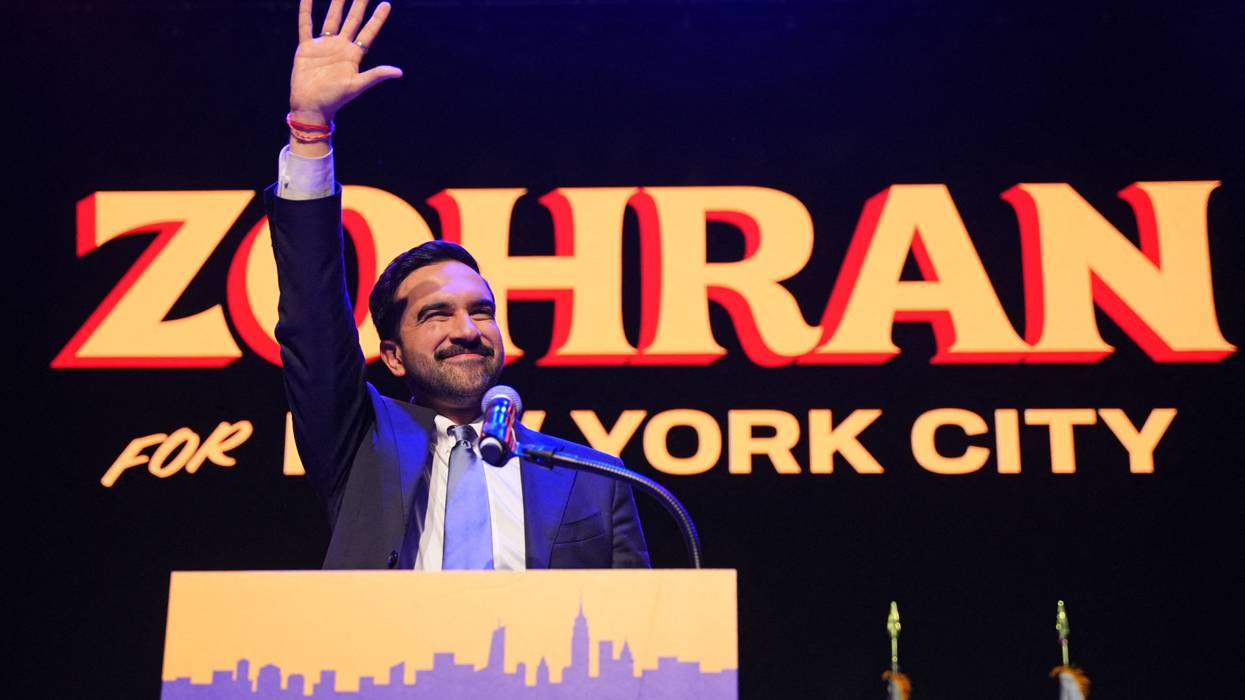 Zohran Mamdani waves to the crowd.