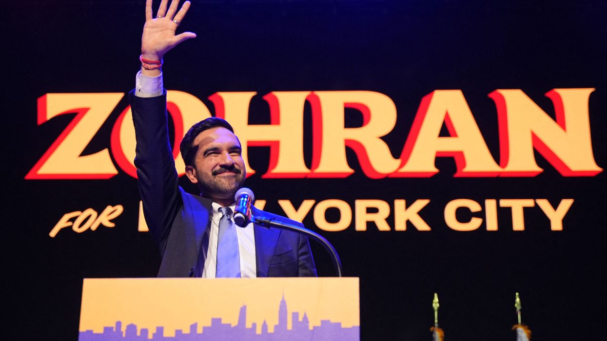 Zohran Mamdani waves to the crowd.