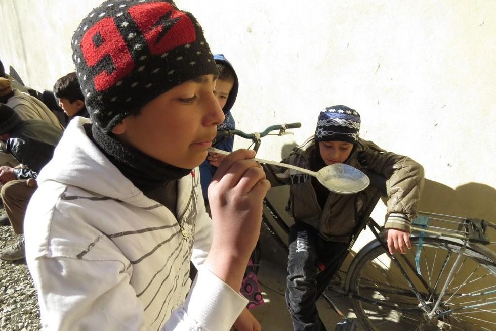 Zuhair playing a game on the importance of saving water at the Borderfree Street Kids School