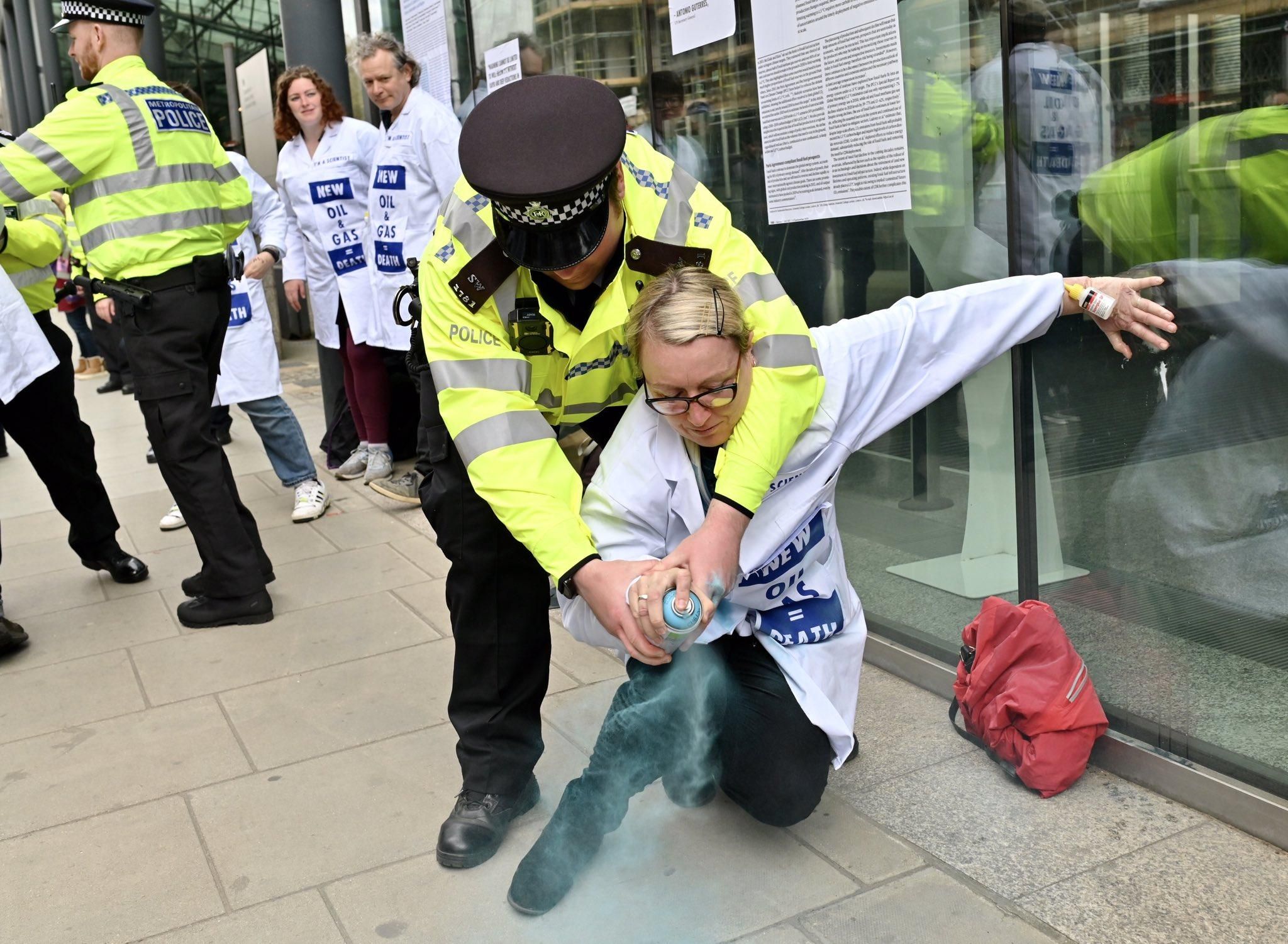 Scientists Glue Hands to UK Business Dept. Demanding End to 'Fossil Fuel  Madness'