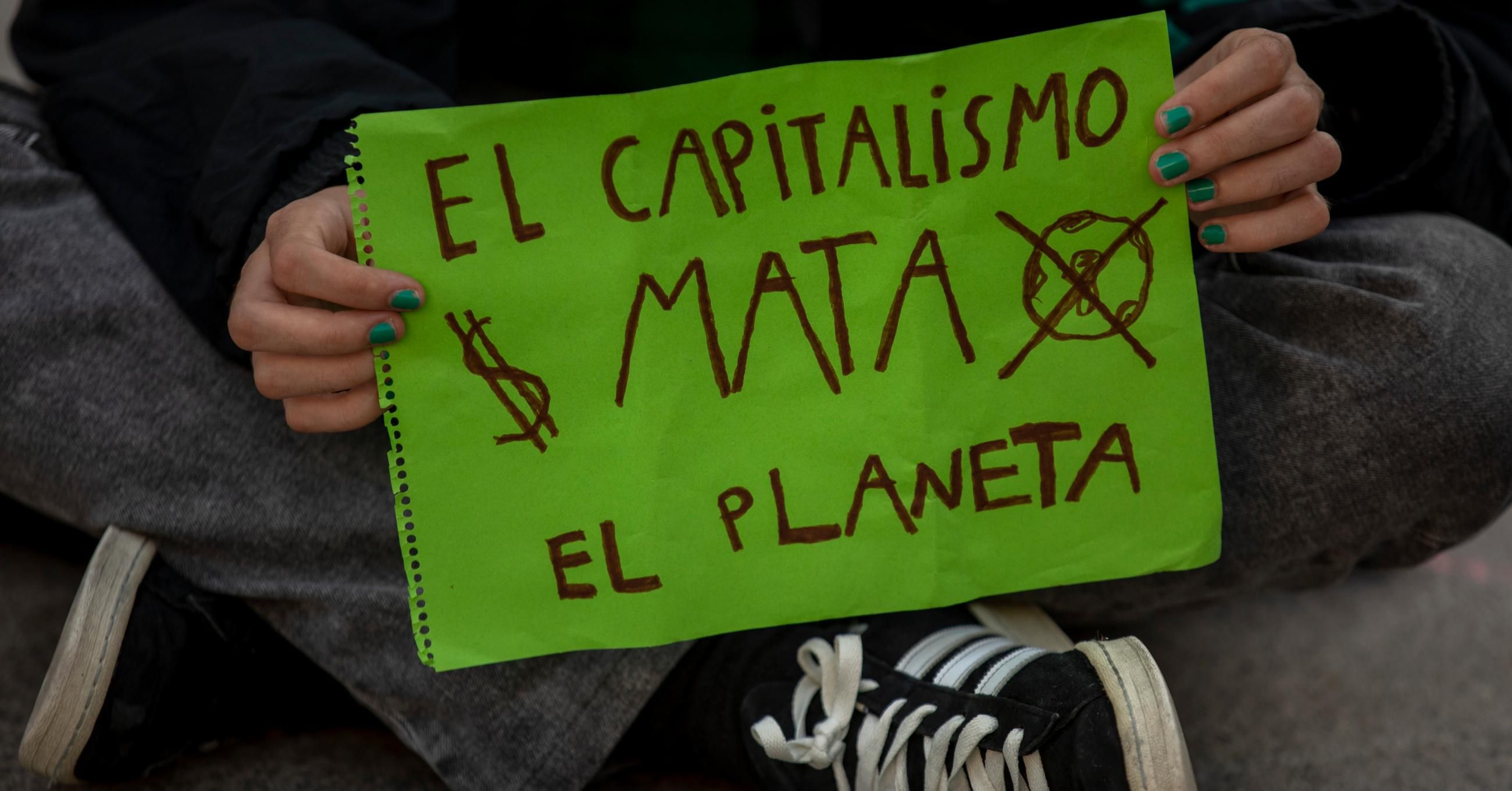 Capitalism kills the planet sign