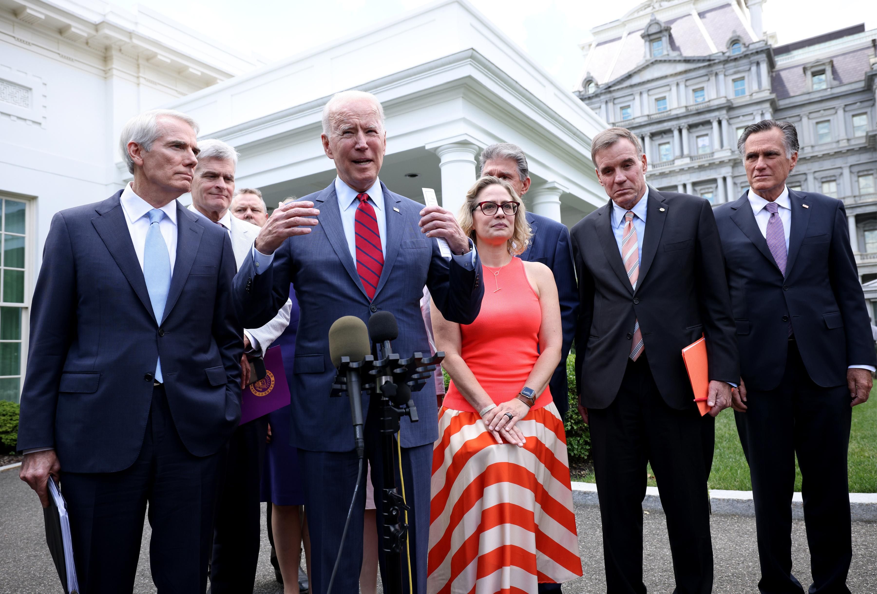 President Joe Biden speaks in front of the White House