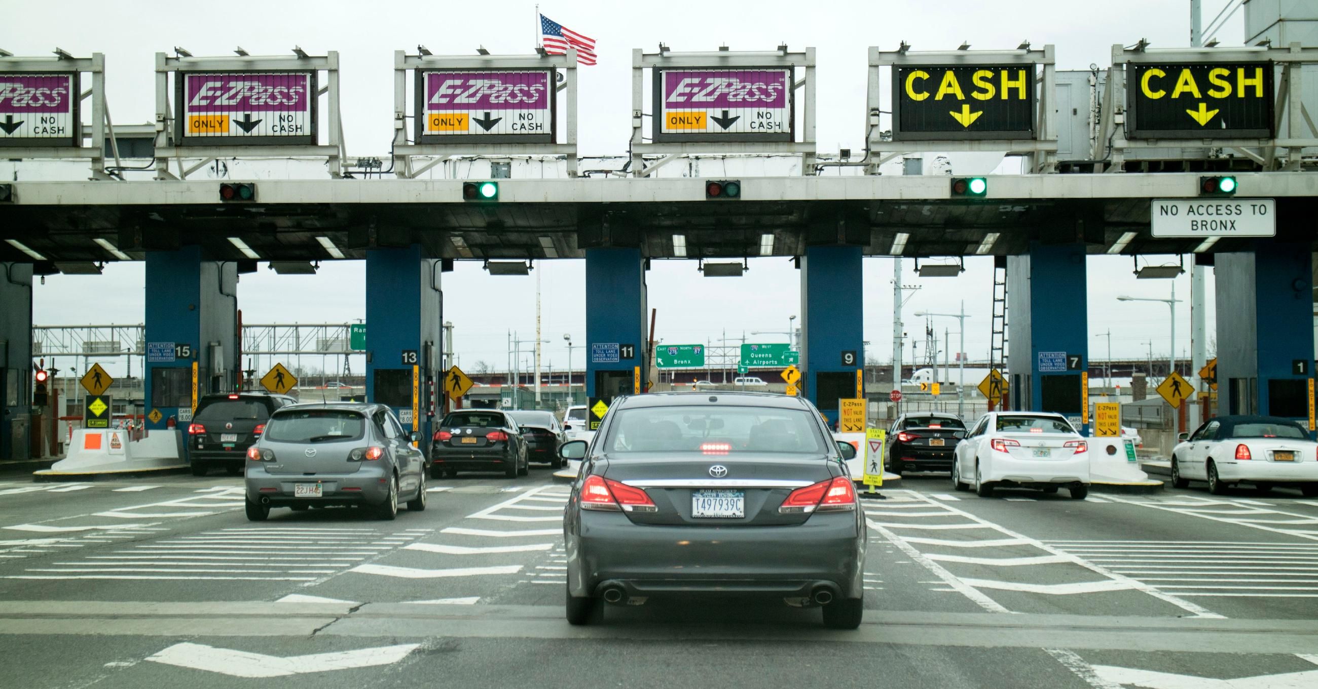 cars wait at a toll plaza