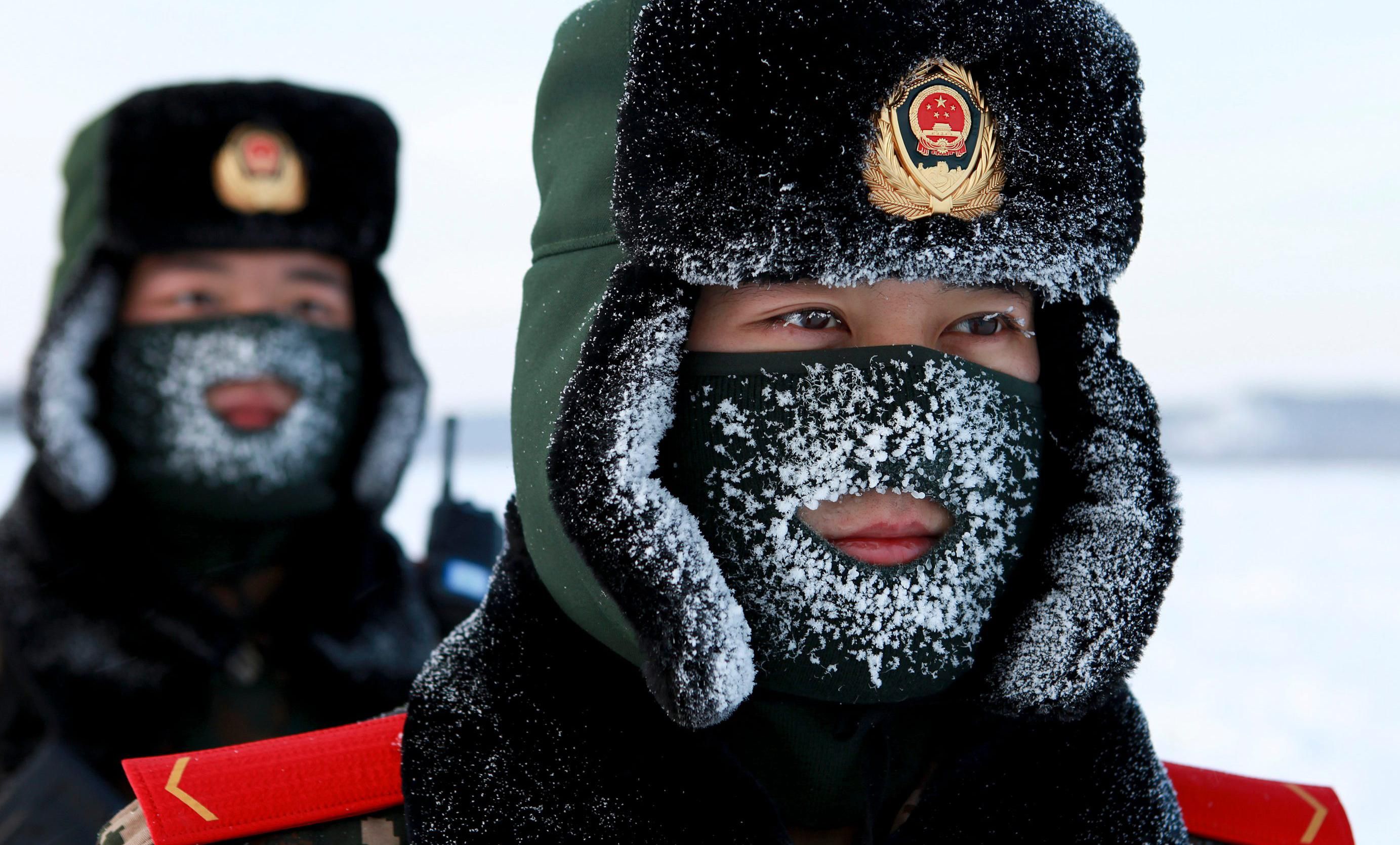 Chinese paramilitary police border guards train in the snow at Mohe County in China's northeast Heilongjiang province, on the border with Russia, on December 12, 2016. 