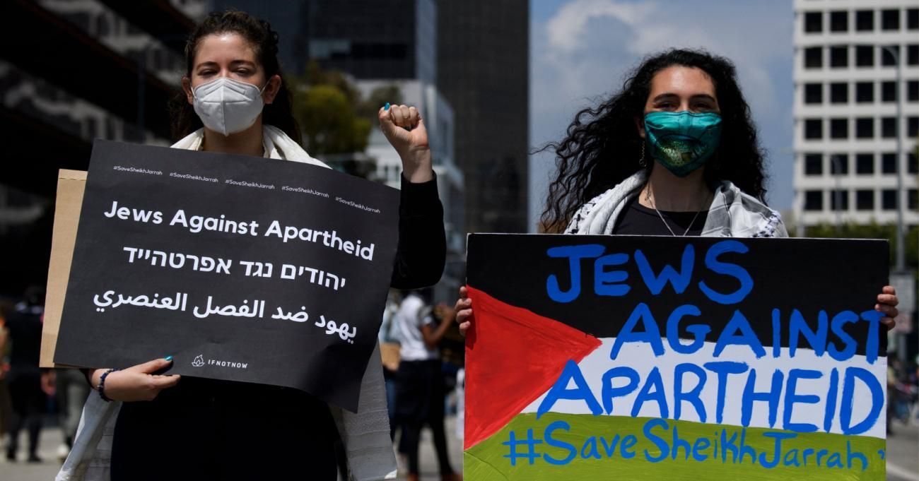 People carry signs reading "Jews Against Apartheid" during the Los Angeles Nakba 73: Resistance Until Liberation rally.
