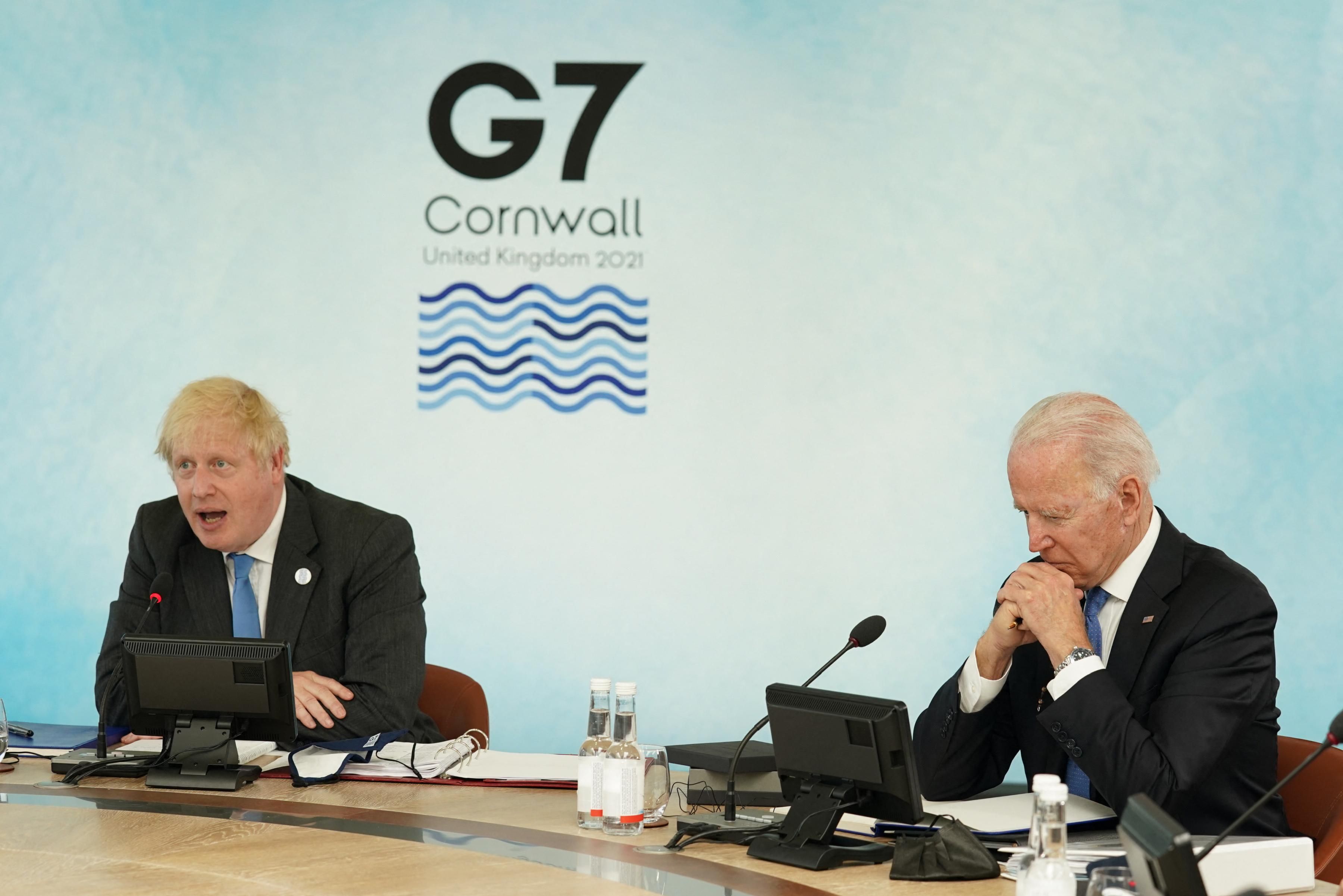 U.K. Prime Minister Boris Johnson sits alongside U.S. President Joe Biden