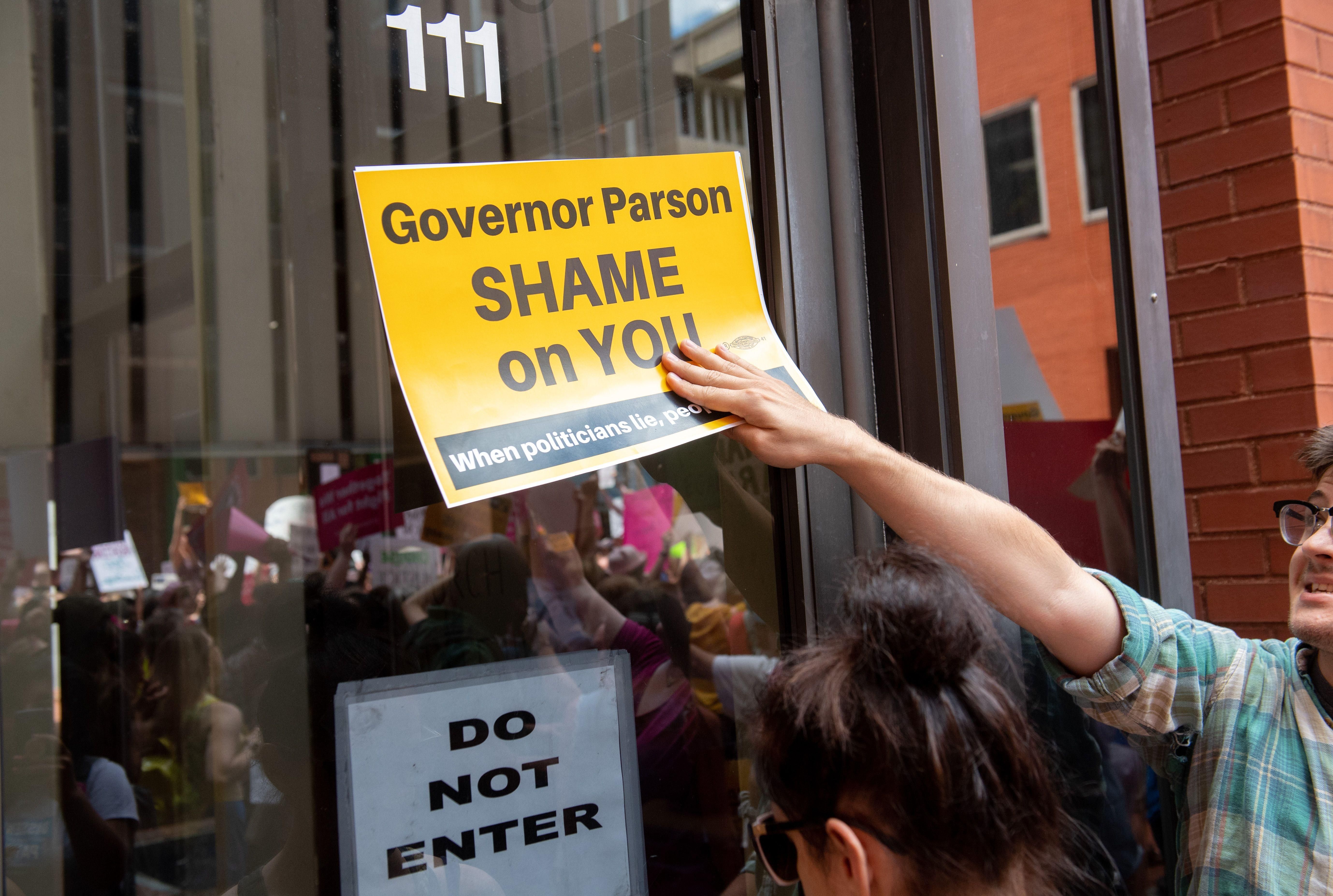 Protesters demonstrate outside of the offices of Missouri's Republican governor.