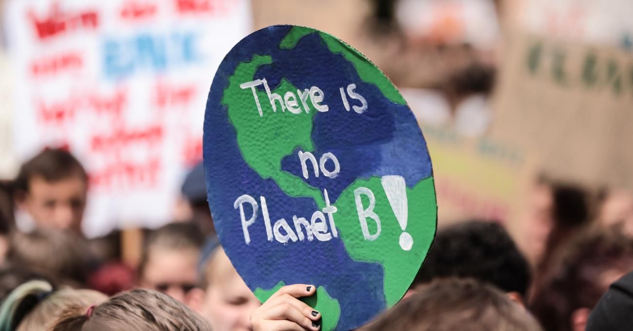 Students demonstrate holding signs reading "There is no Planet B" during the Fridays for Future climate strikes in May 2019.