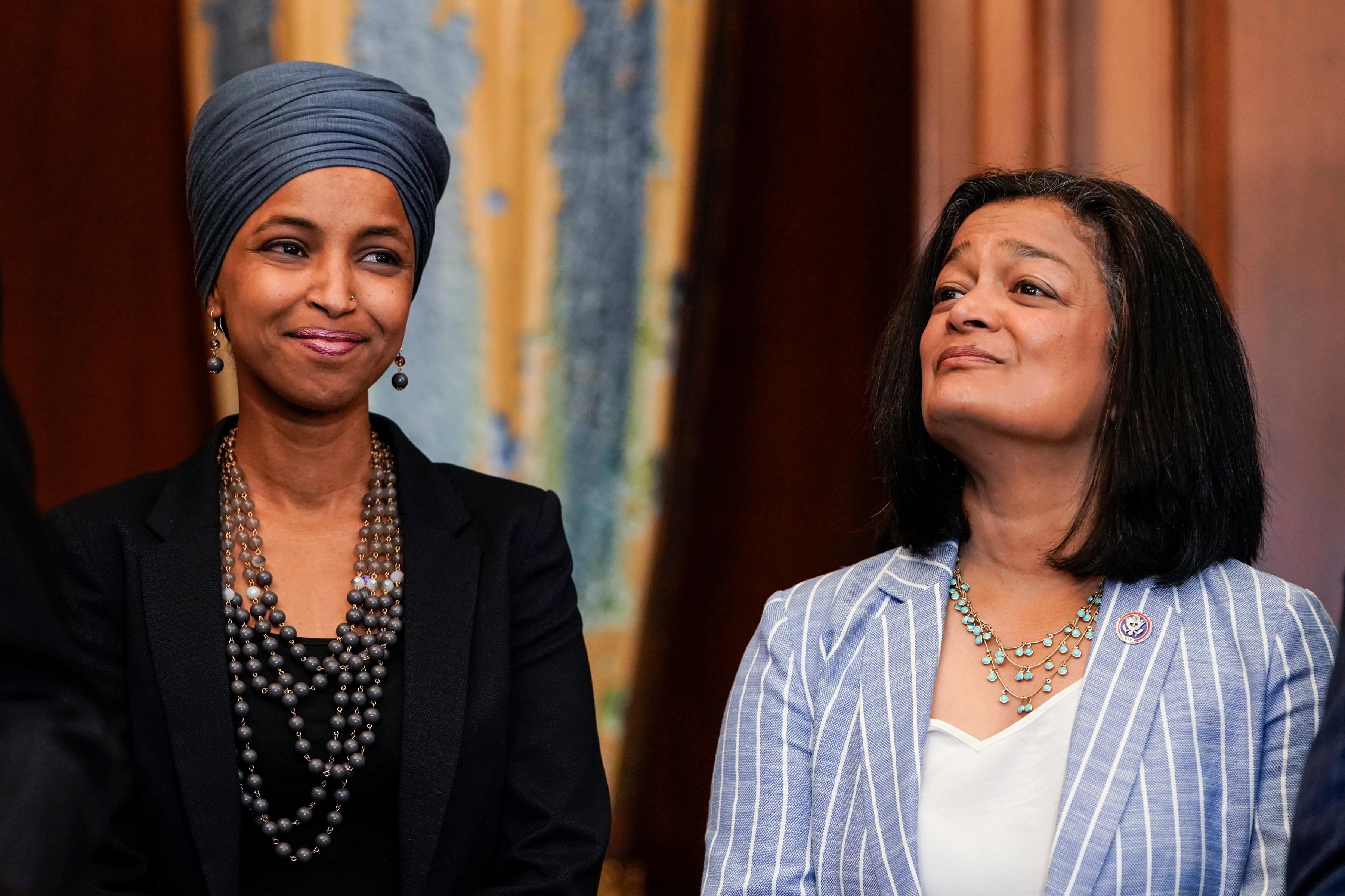Reps. Ilhan Omar and Pramila Jayapal attend an event in Washington, D.C.