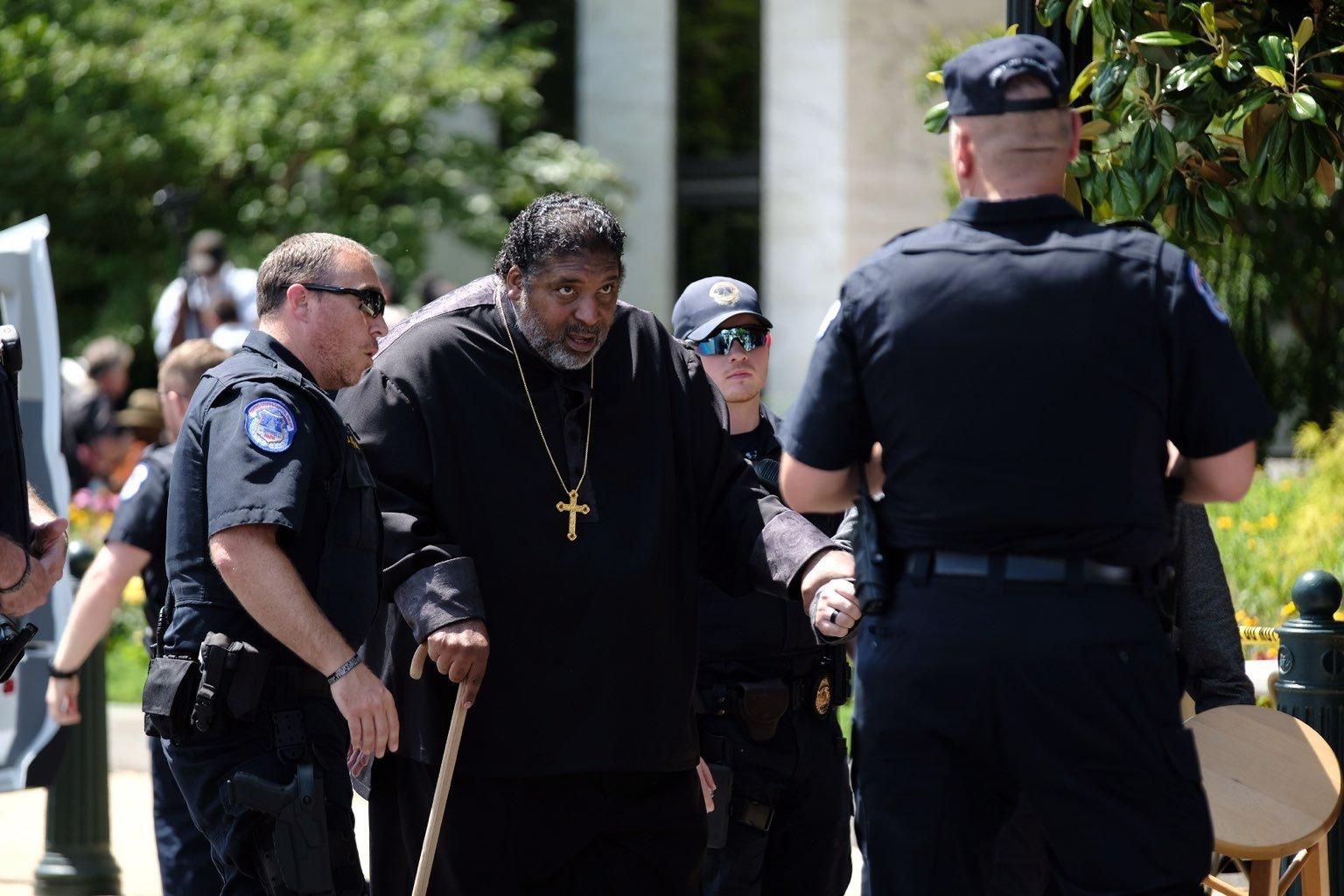 Rev. William Barber is arrested during a protest