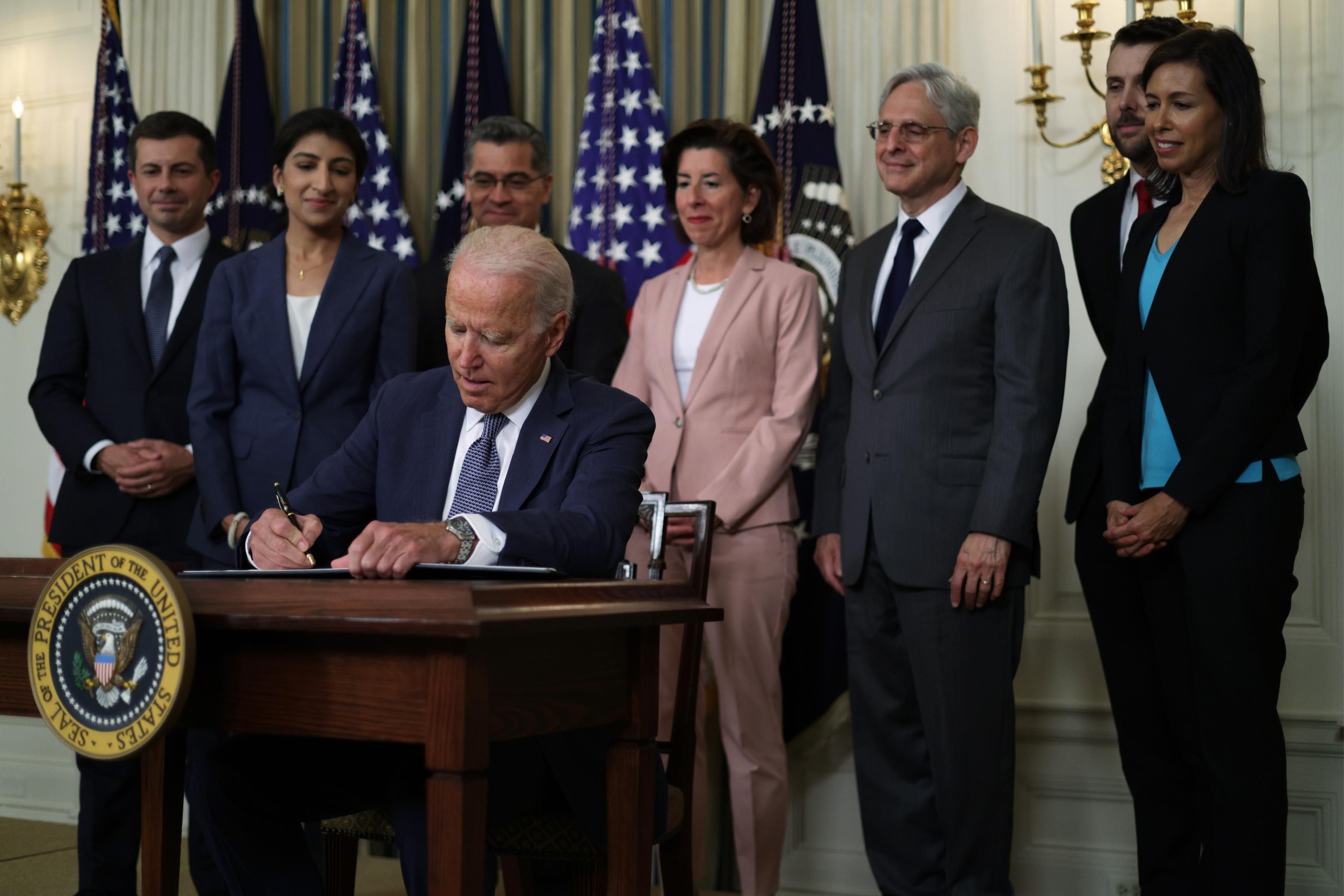 President Joe Biden signs an executive order