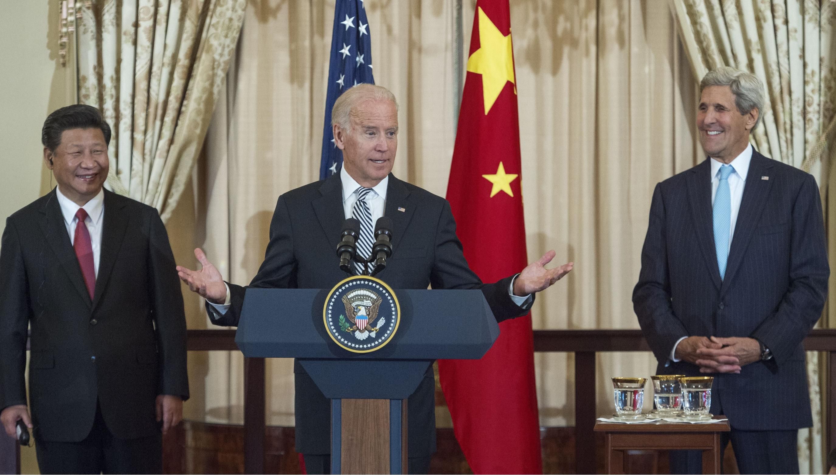 Chinese President Xi Jinping and then-U.S. Secretary of State John Kerry listen as then-U.S. Vice President Joe Biden speaks during a luncheon hosted by Kerry on September 25, 2015 in Washington, D.C. (Photo: Paul J. Richards/AFP via Getty Images)