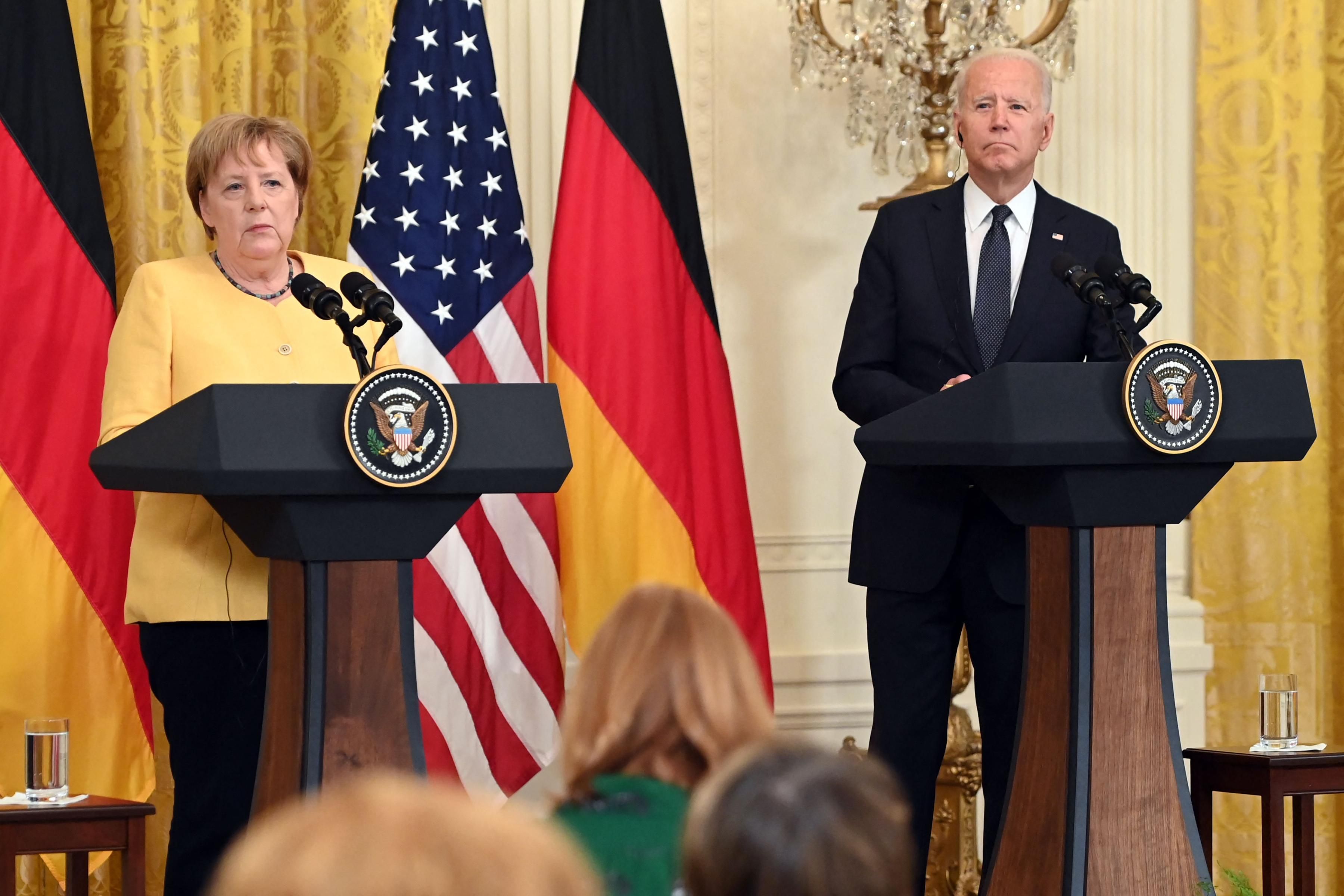 U.S. President Joe Biden and German Chancellor Angela Merkel speak at a press conference