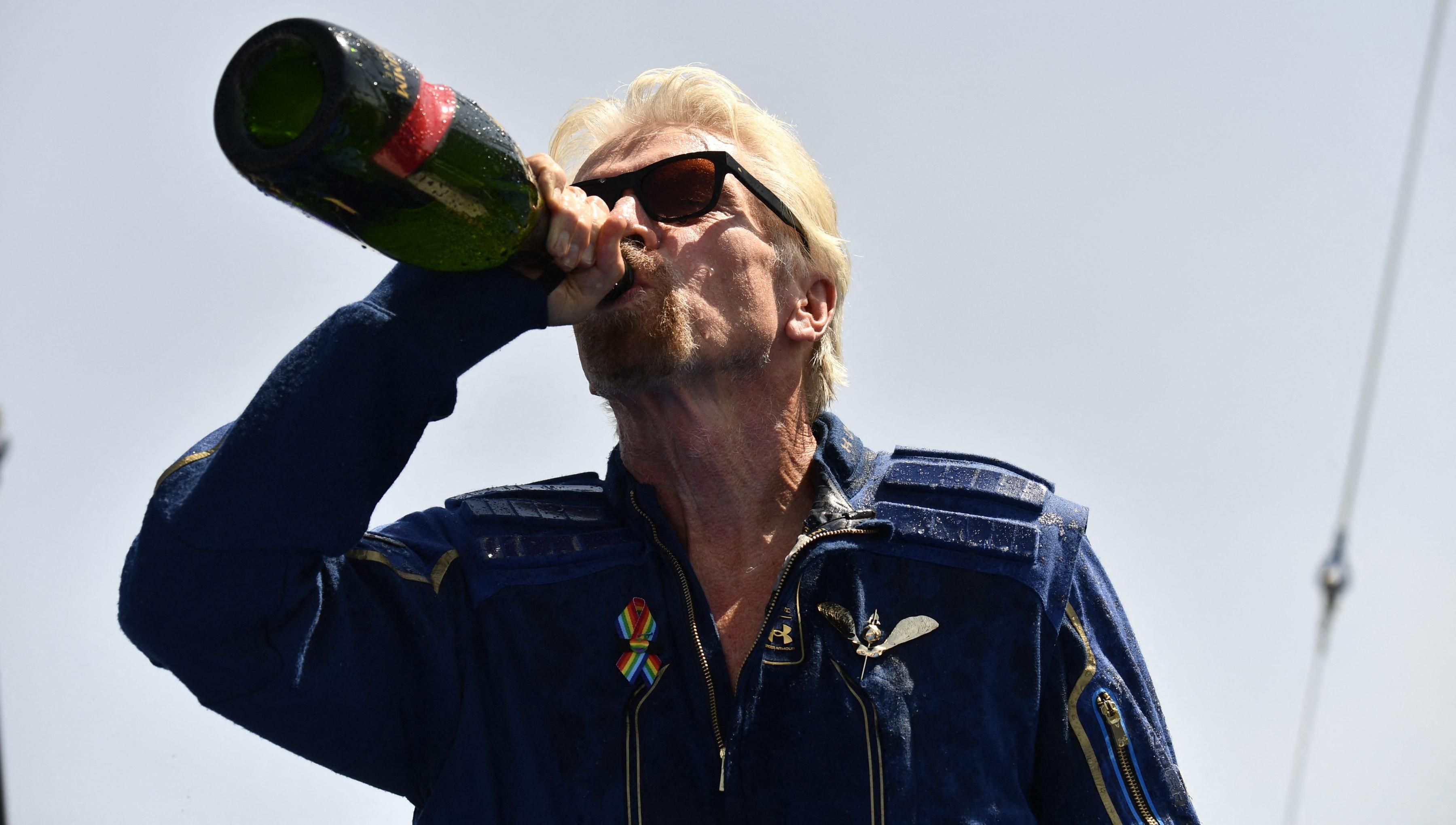 Richard Branson drinking champaign after space launch