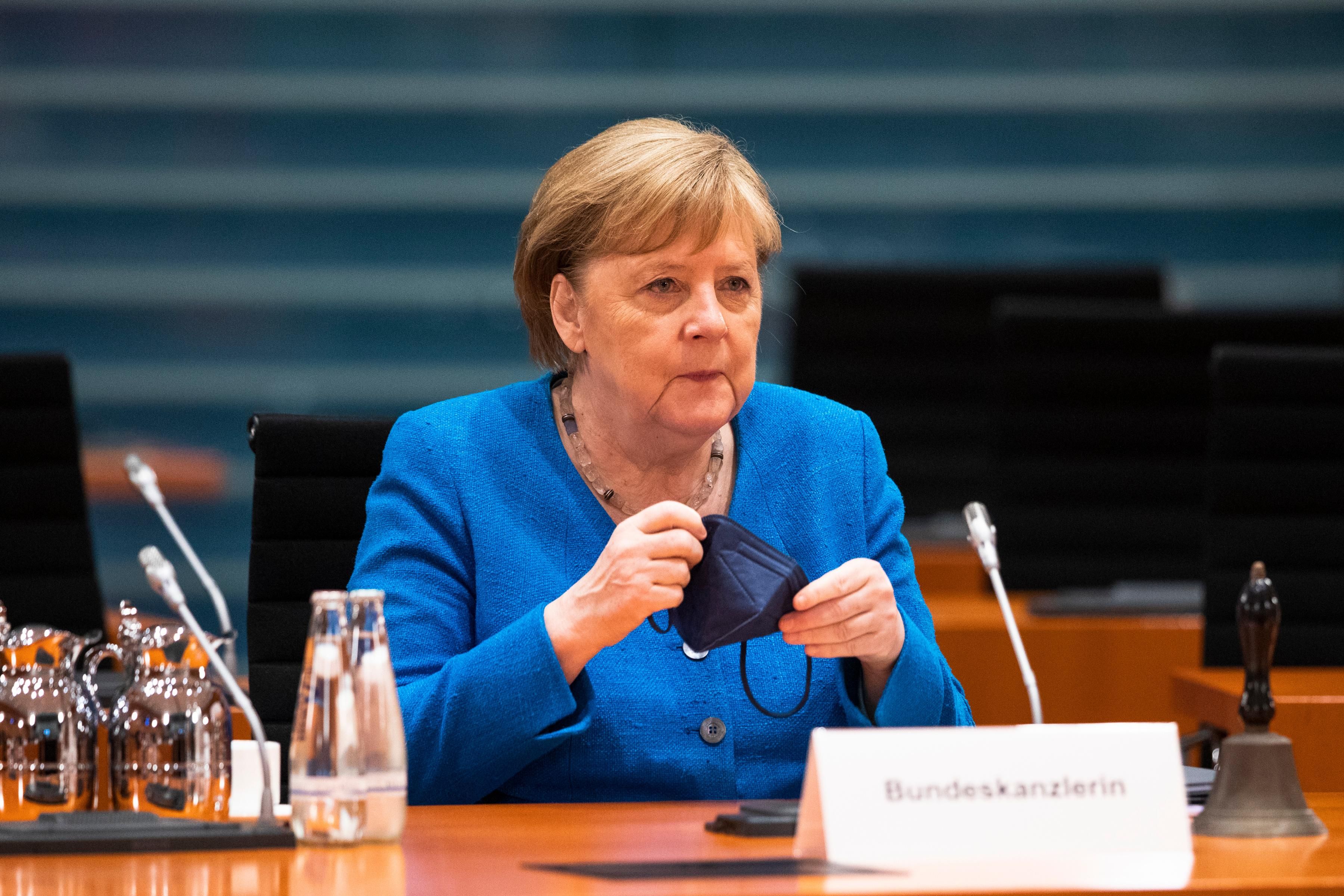 Angela Merkel arrives at a cabinet meeting