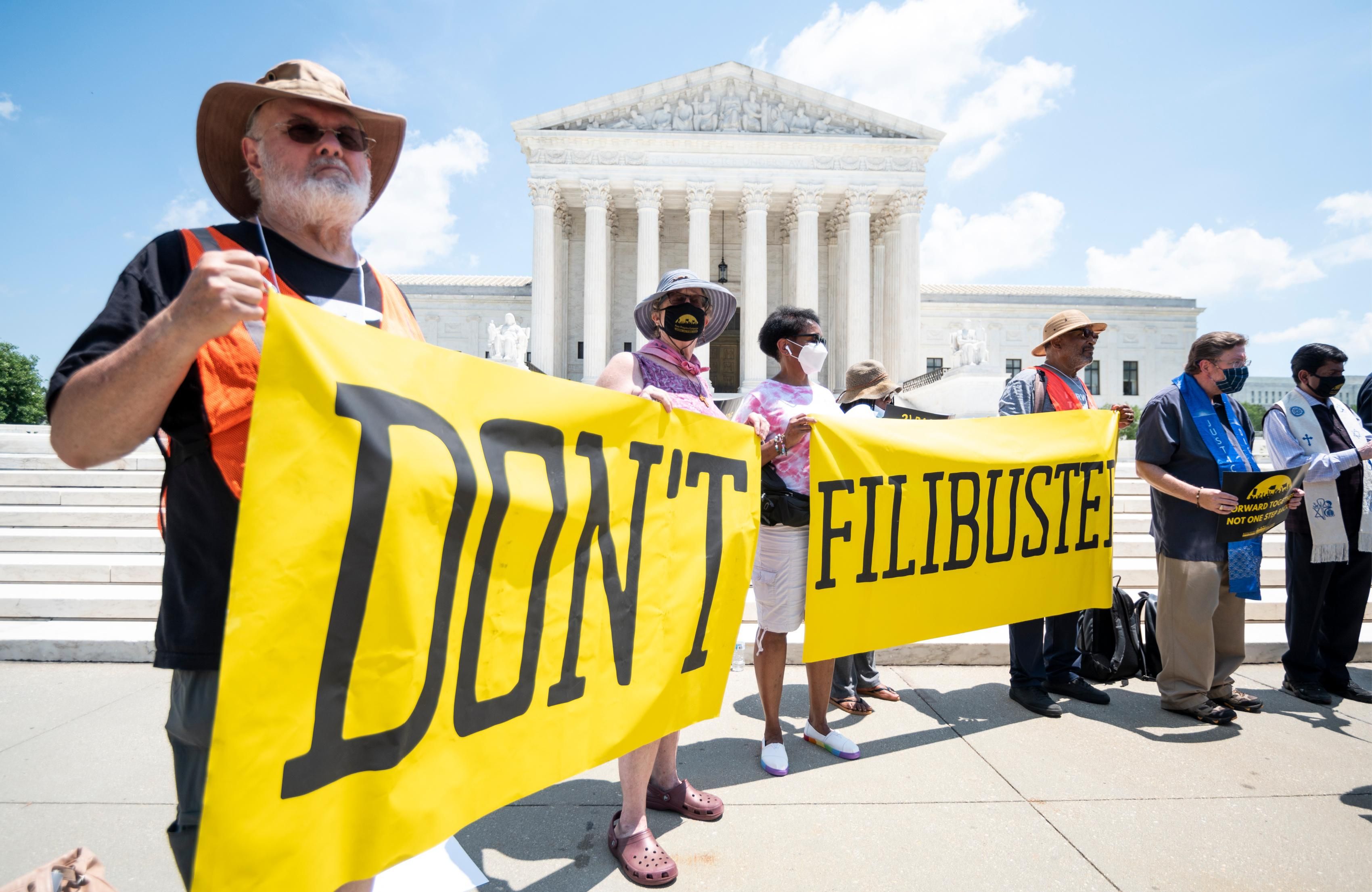 Participants hold "Don't Filibuster" banners during the Poor People's Campaign news conference in front of the U.S. Supreme Court on July 12, 2021, to announce a season of nonviolent direct action. (Photo: Bill Clark/CQ-Roll Call, Inc via Getty Images)