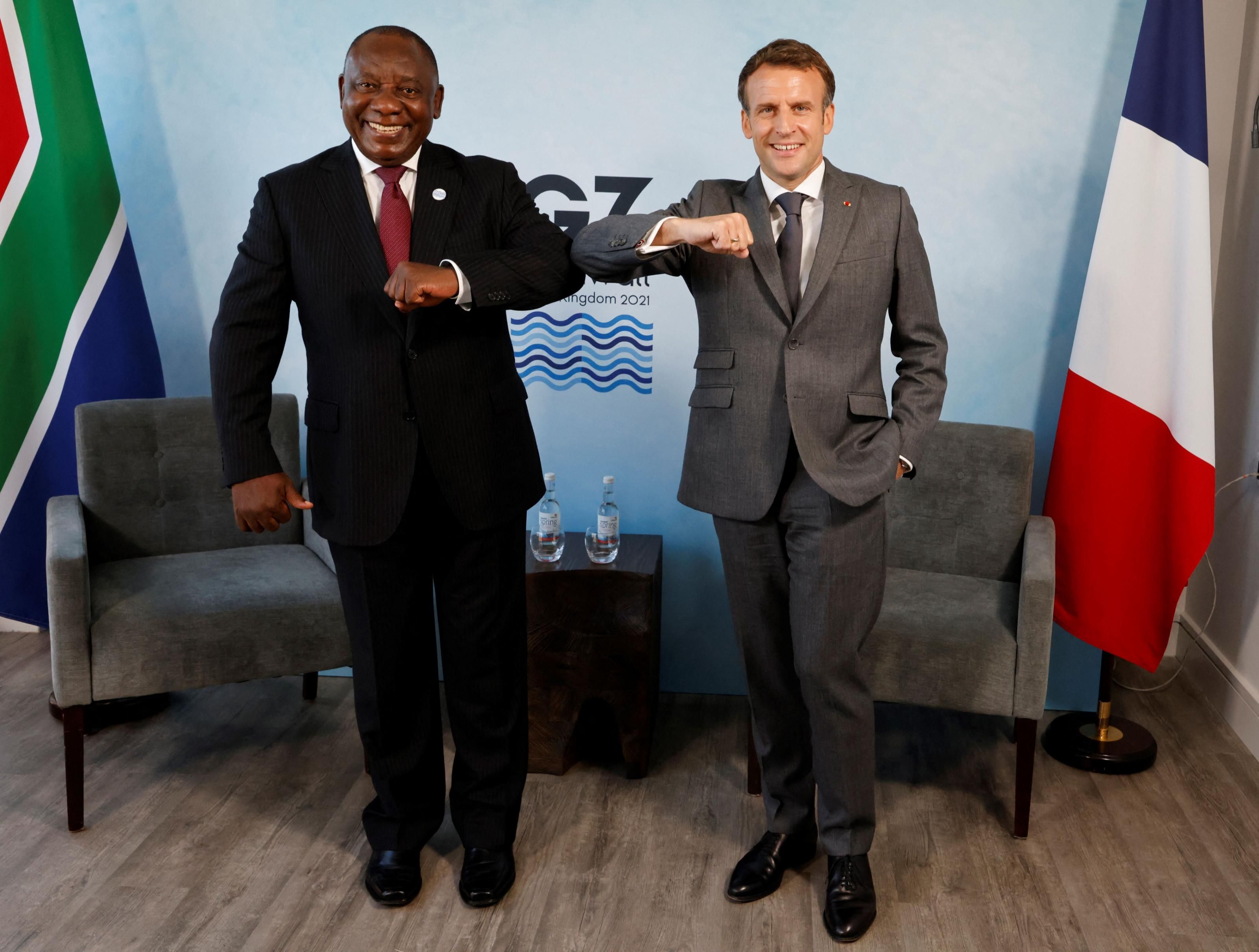 South Africa's President Cyril Ramaphosa (L) greets France's President Emmanuel Macron before a bilateral meeting during the G7 summit in Carbis Bay, Cornwall on June 12, 2021. (Phot: Ludovic Marin/AFP via Getty Images)