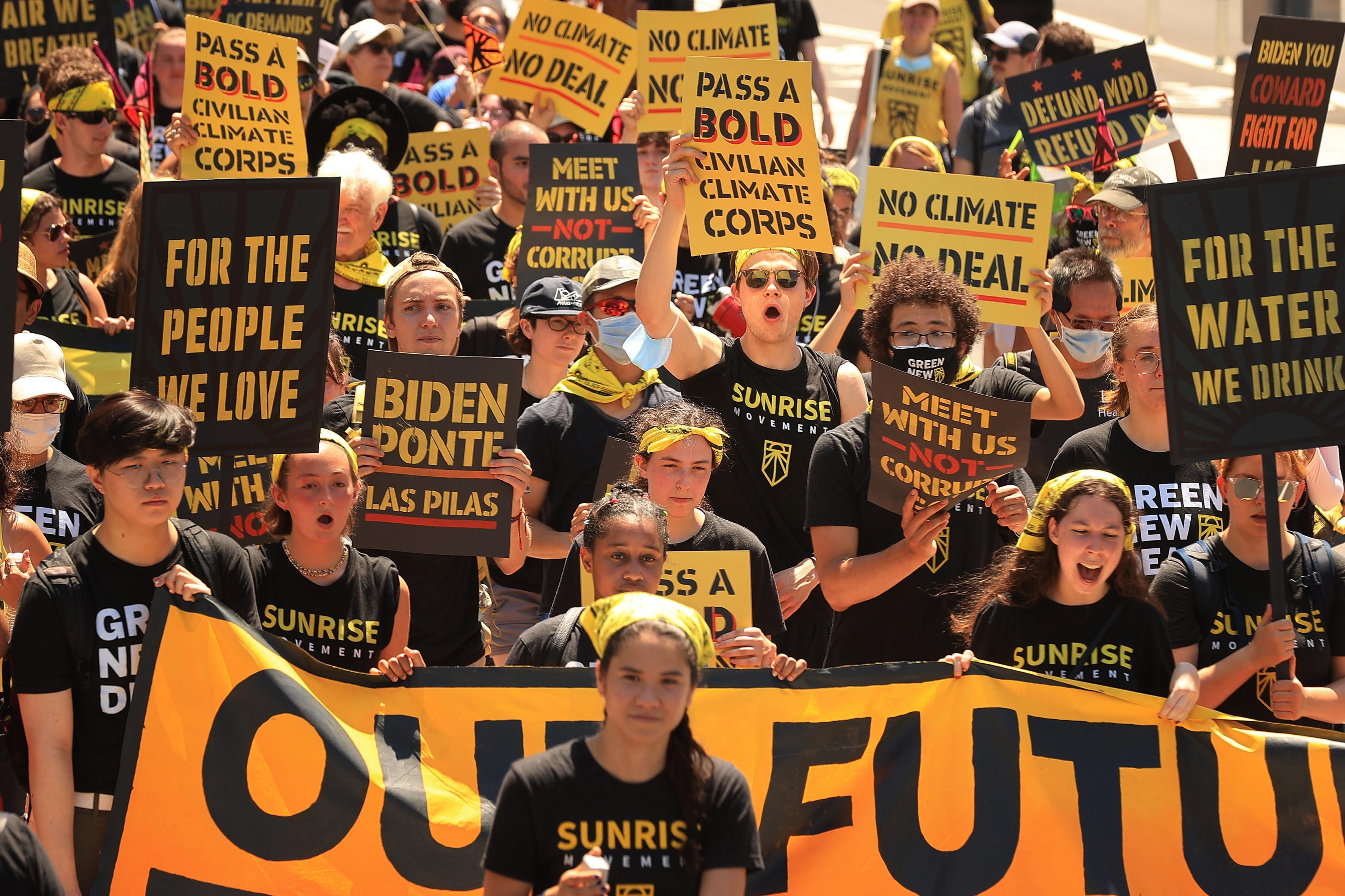 Activists with the Sunrise Movement march to the White House