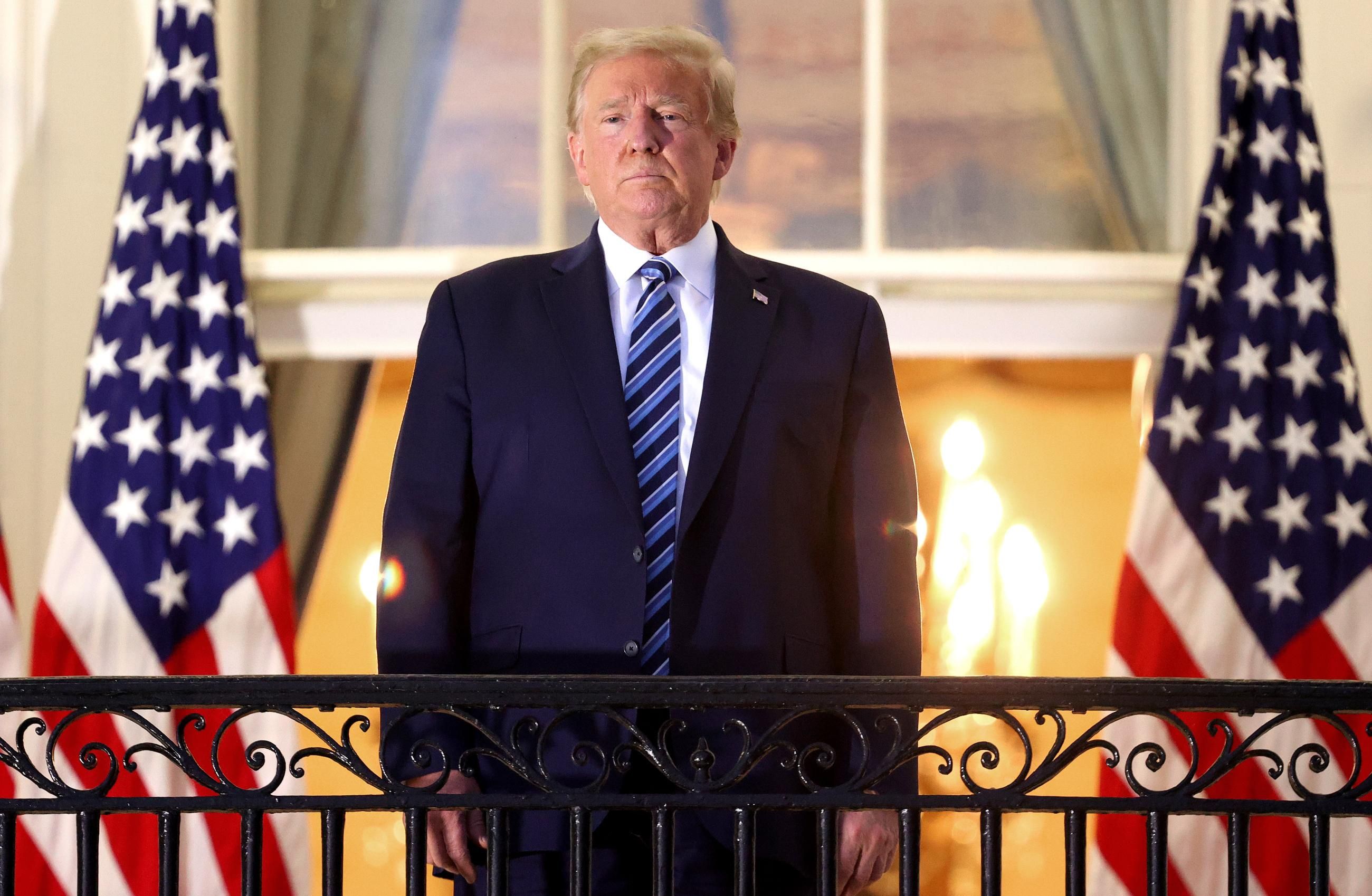 Then-President Donald Trump stands on the Truman Balcony after returning to the White House from Walter Reed National Military Medical Center on October 5, 2020 in Washington, D.C.&nbsp;(Photo: Win McNamee via Getty Images)