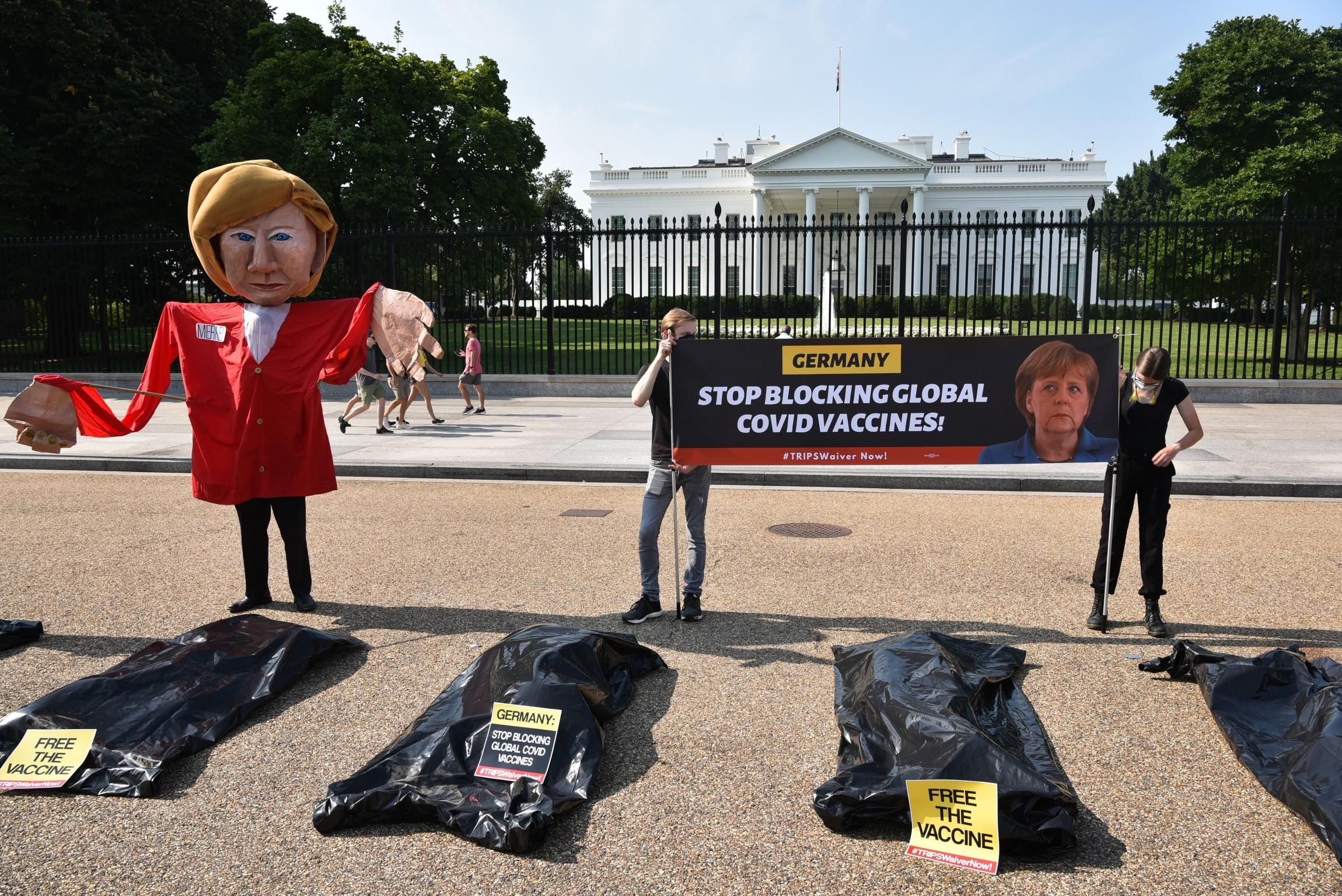 An effigy of German Chancellor Angela Merkel is displayed during a protest calling for the suspension of intellectual property barriers to facilitate the increased production of Covid-19 vaccines, at Lafayette Square in front of the White House in Washington, D.C. on July 15, 2021. (Photo: Mandel Ngan/AFP via Getty Images)