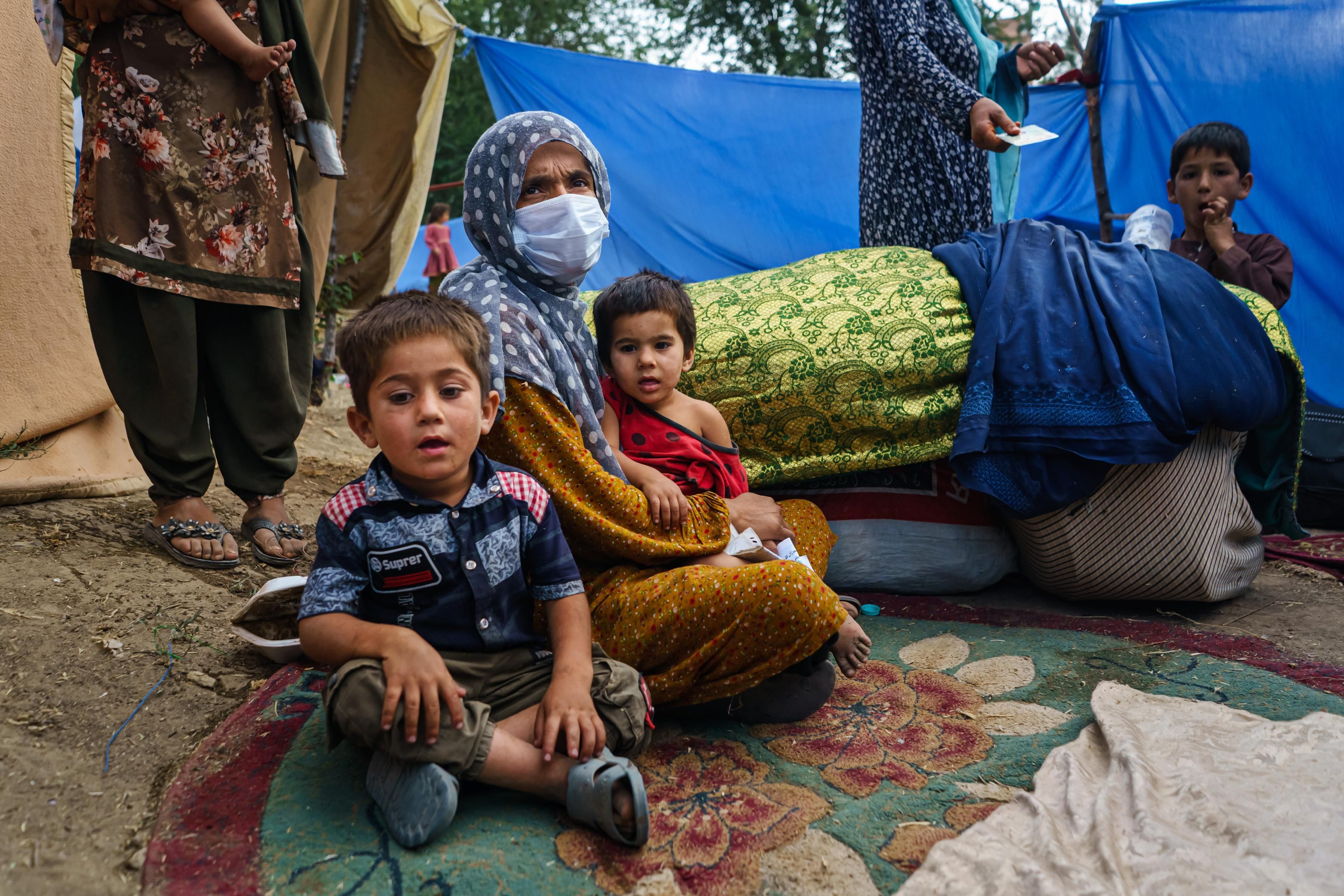 Afghans flee fighting between the Taliban and Afghan security forces