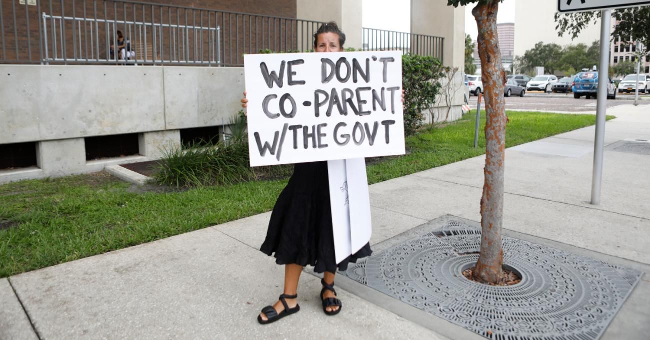 A woman protests mask mandates in Florida.