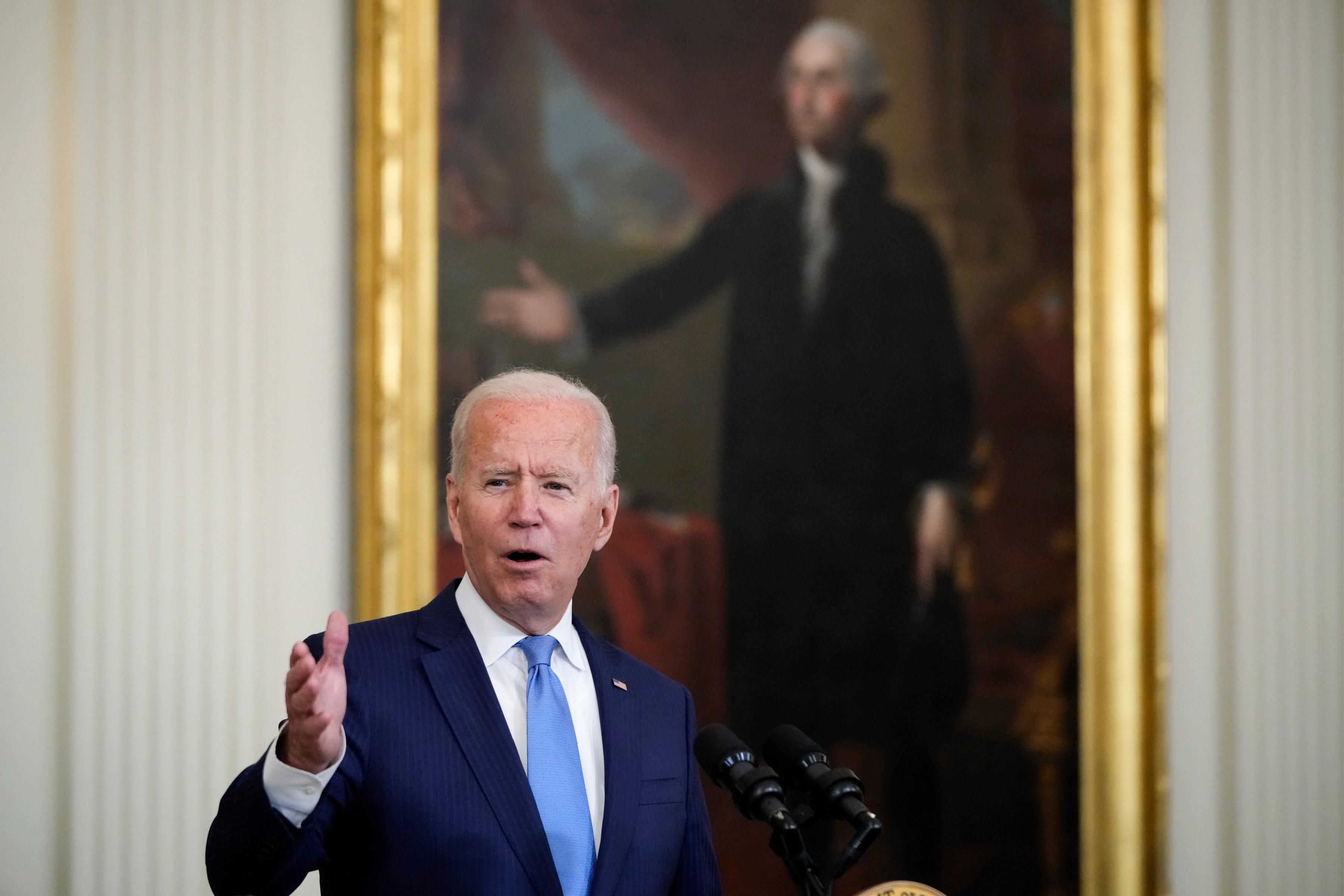 President Joe Biden speaks to reporters