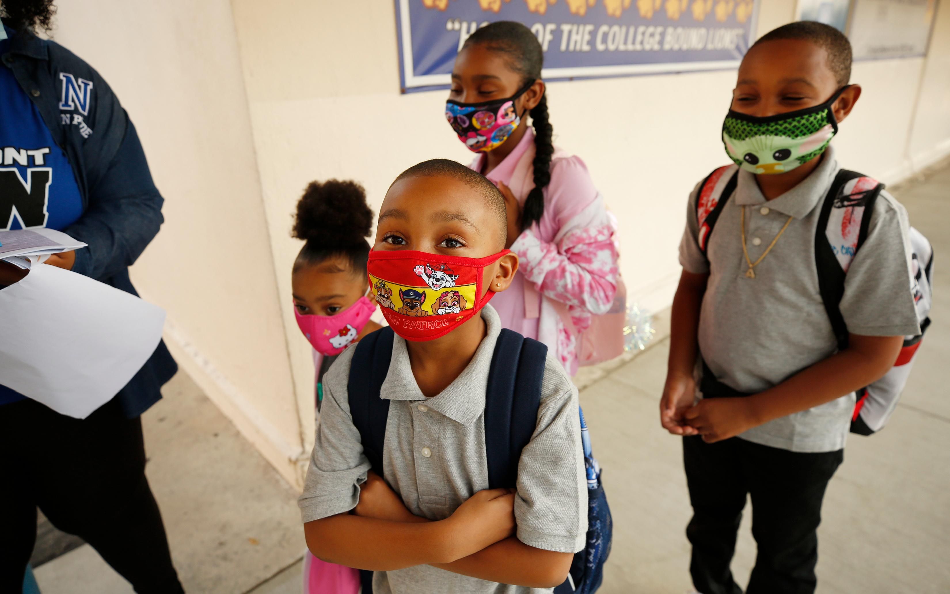 Students make their way to the front door of Normont Elementary School in Harbor City, California on the first day of in-person instruction on August 16, 2021. (Photo: Al Seib/Los Angeles Times via Getty Images)