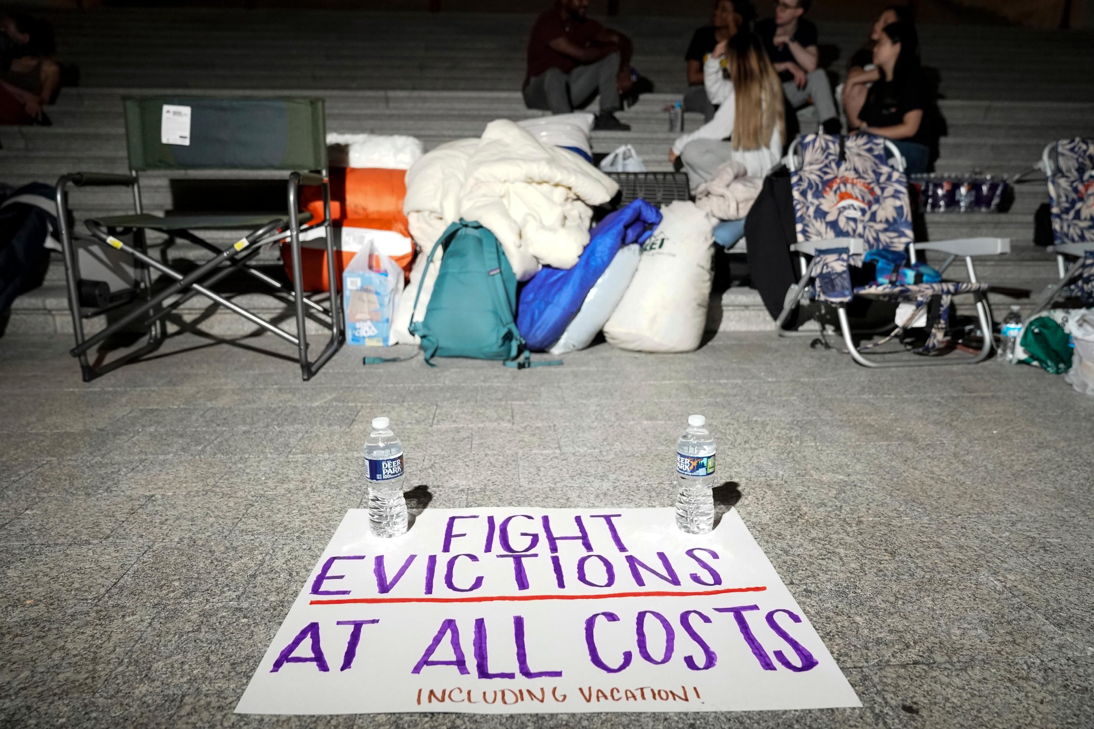 A sign urging Congress to fight evictions at all costs