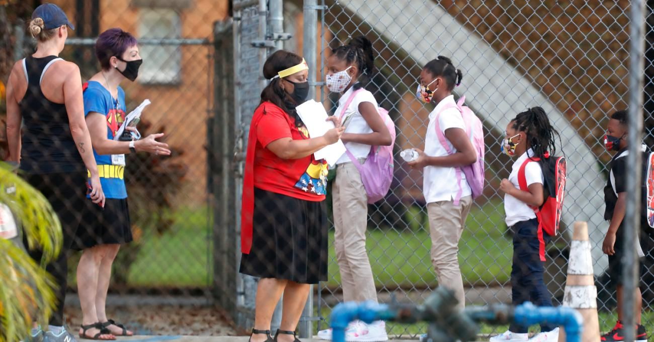 Students arrive at school wearing face masks in Tampa, Florida.