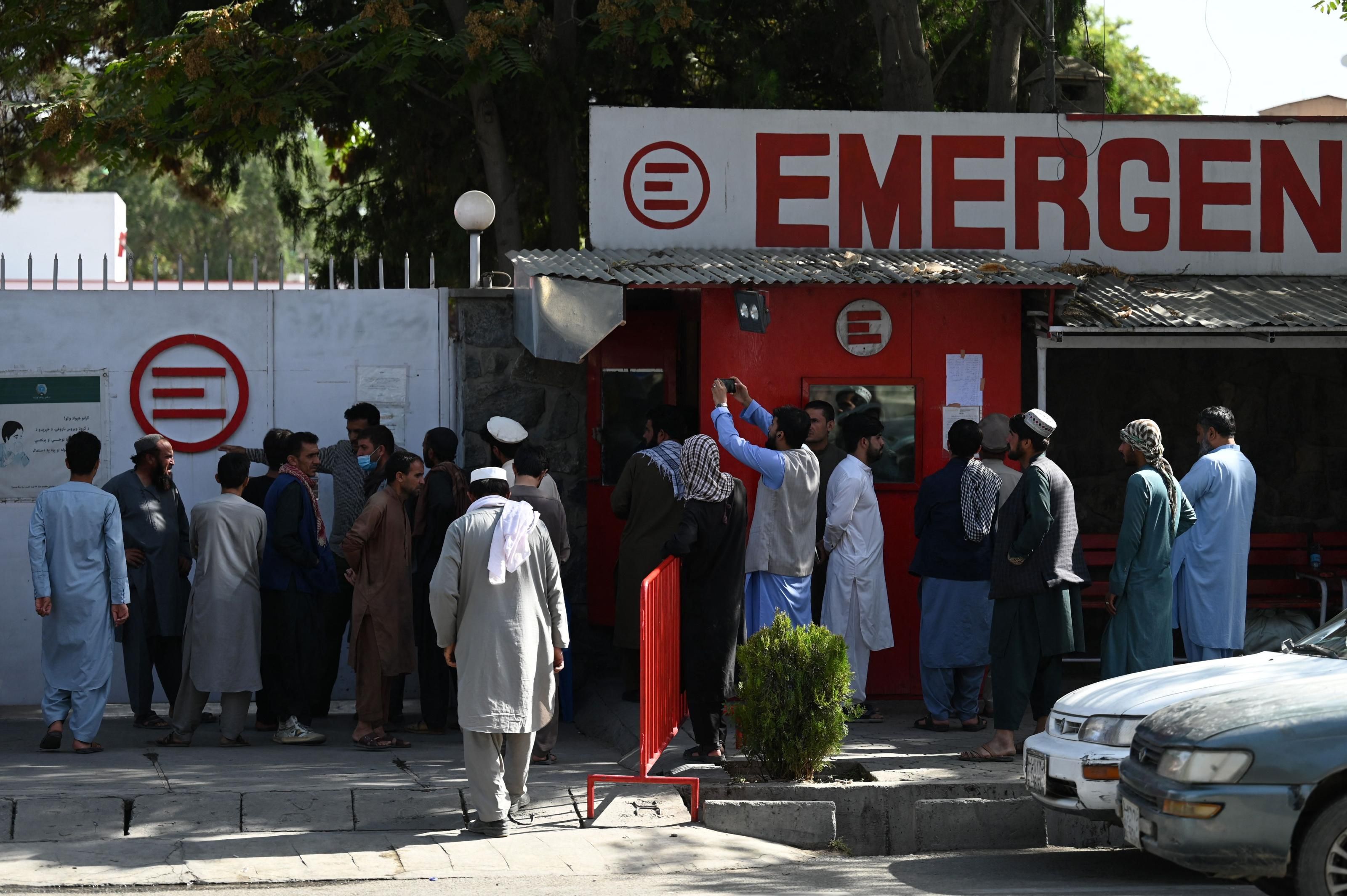 People gather to check on missing relatives a day after a deadly attack outside Kabul's international airport, at a hospital run by Italian NGO Emergency, in Kabul, Afghanistan on August 27, 2021. (Photo: Aamir Qureshi/AFP via Getty Images)