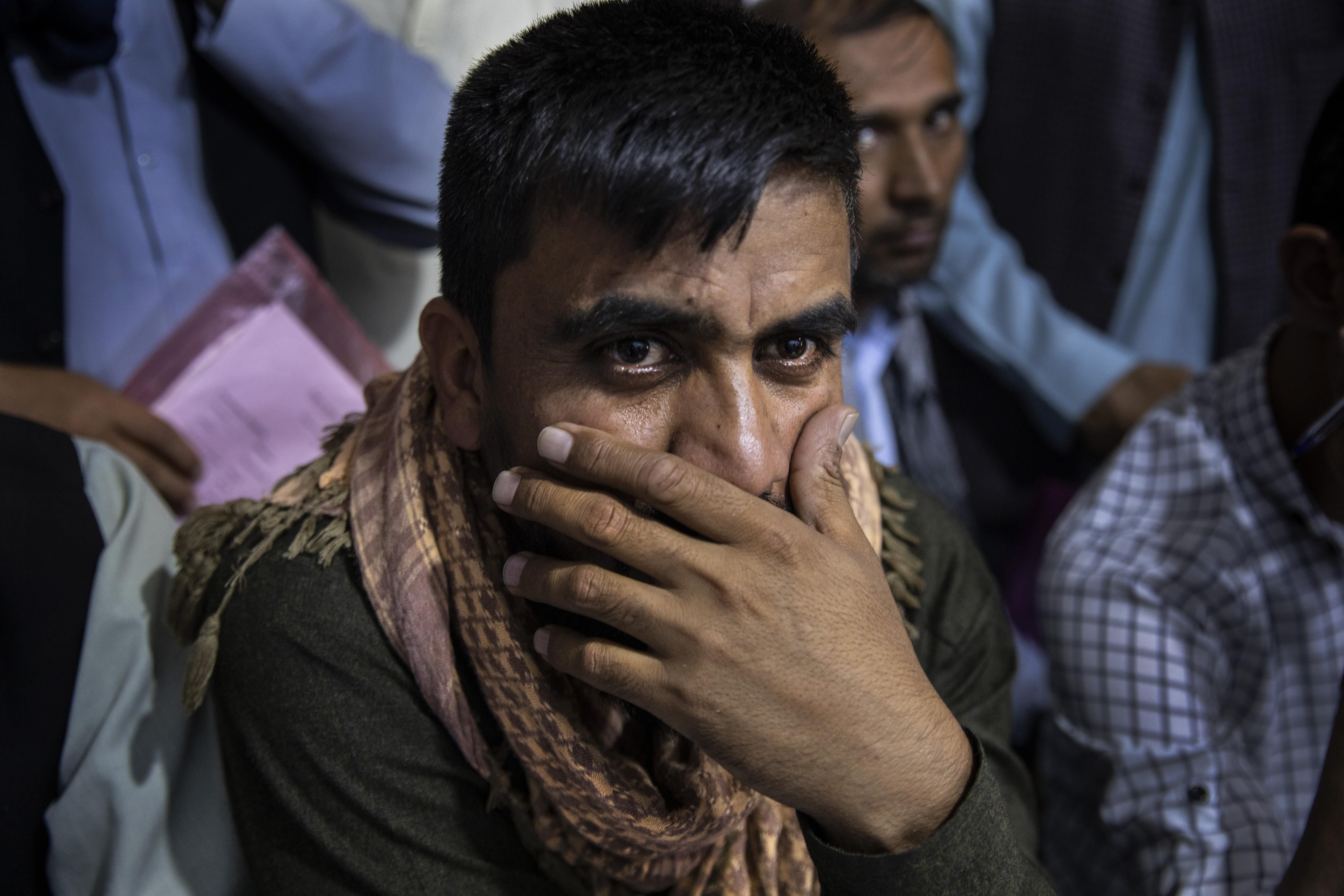 Afghan Special Immigrant Visa applicants crowd into the Herat Kabul Internet cafe