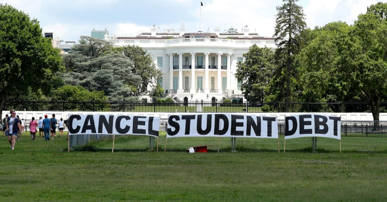 Advocates protest outside the White House, demanding student debt cancellation.
