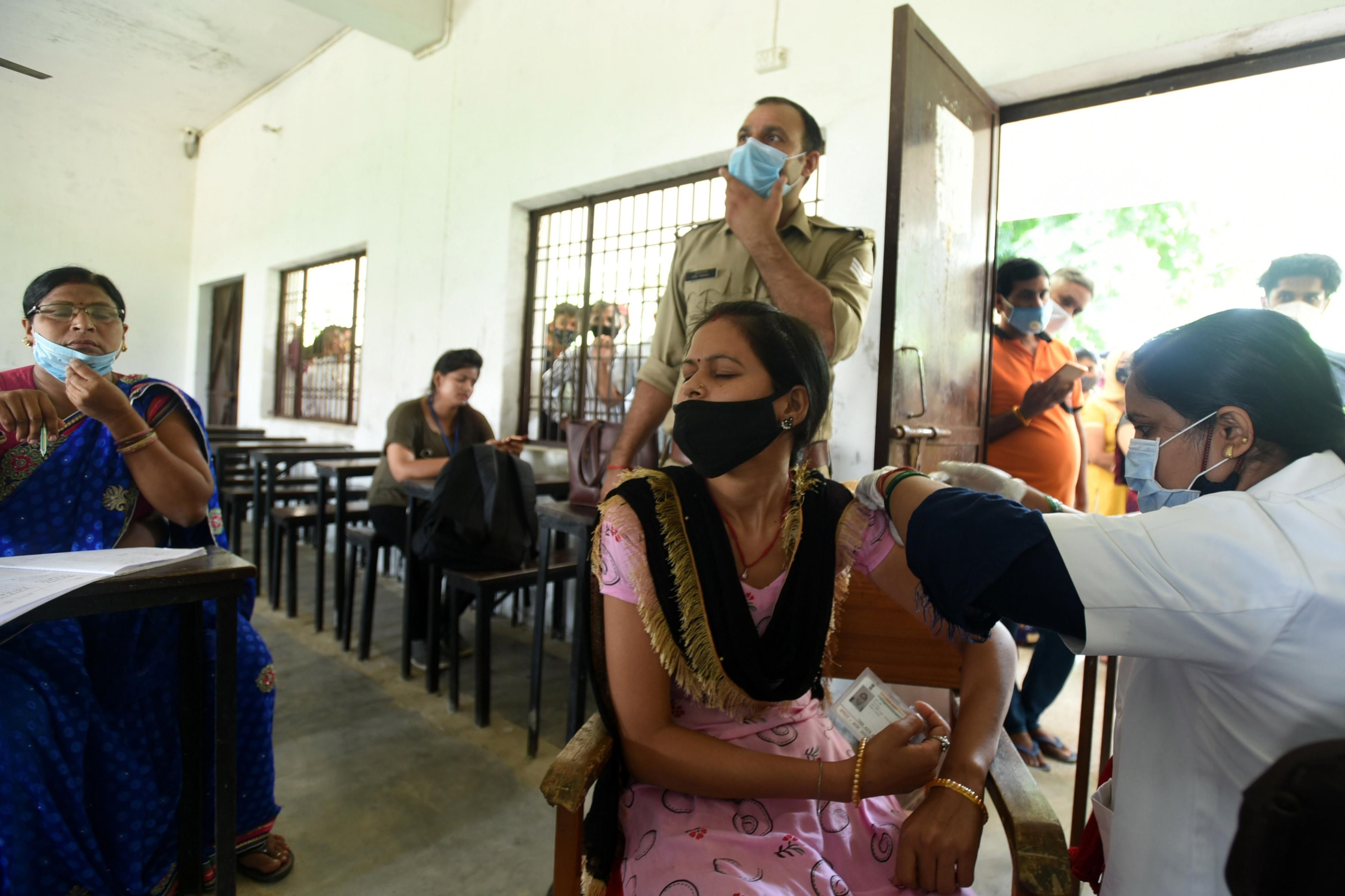 A person in India receives a coronavirus vaccine 