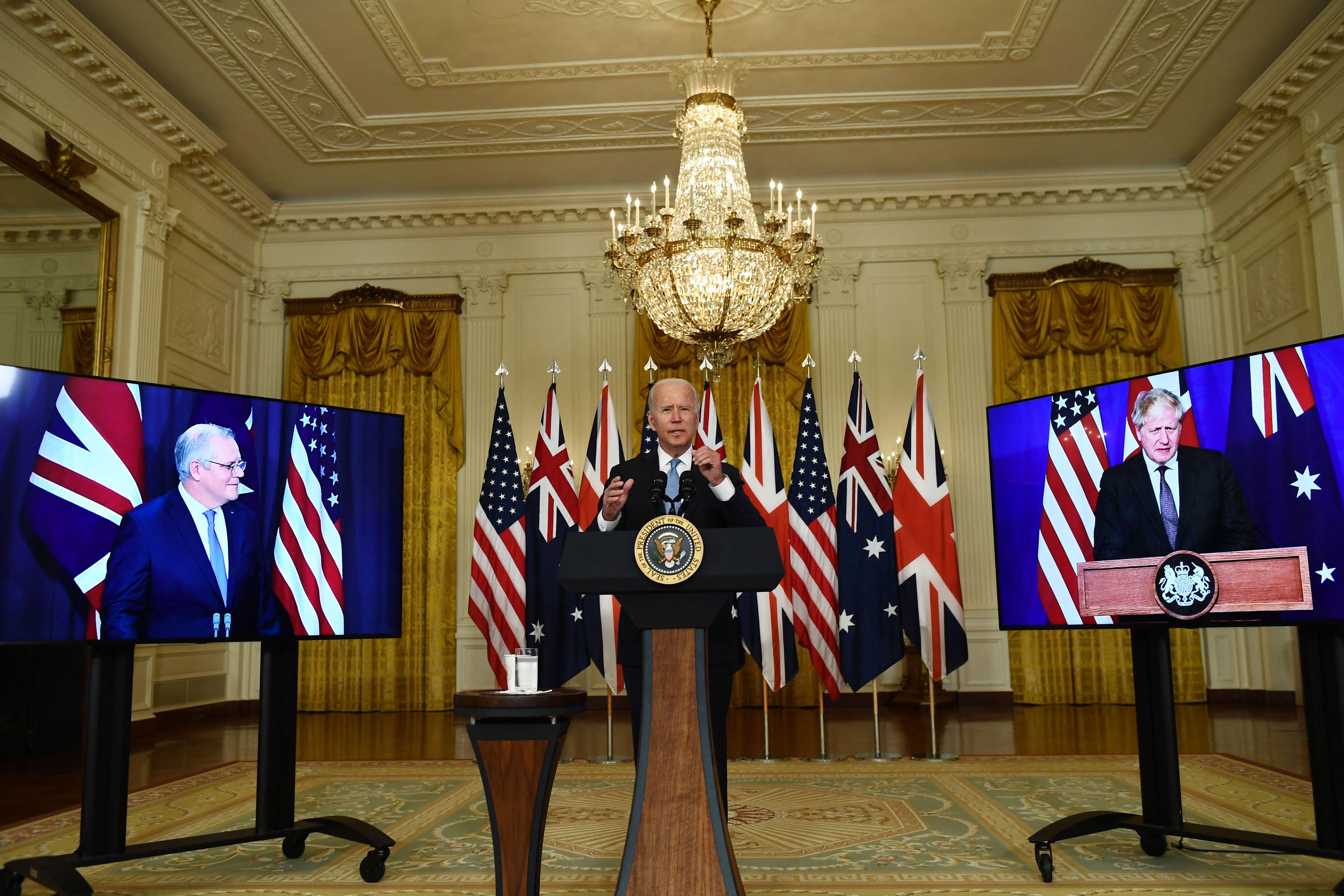 U.S. President Joe Biden participates is a virtual press conference with British Prime Minister Boris Johnson (right) and Australian Prime Minister Scott Morrison in the East Room of the White House in Washington, D.C. on September 15, 2021. (Photo: Brendan Smialowski/AFP via Getty Images)