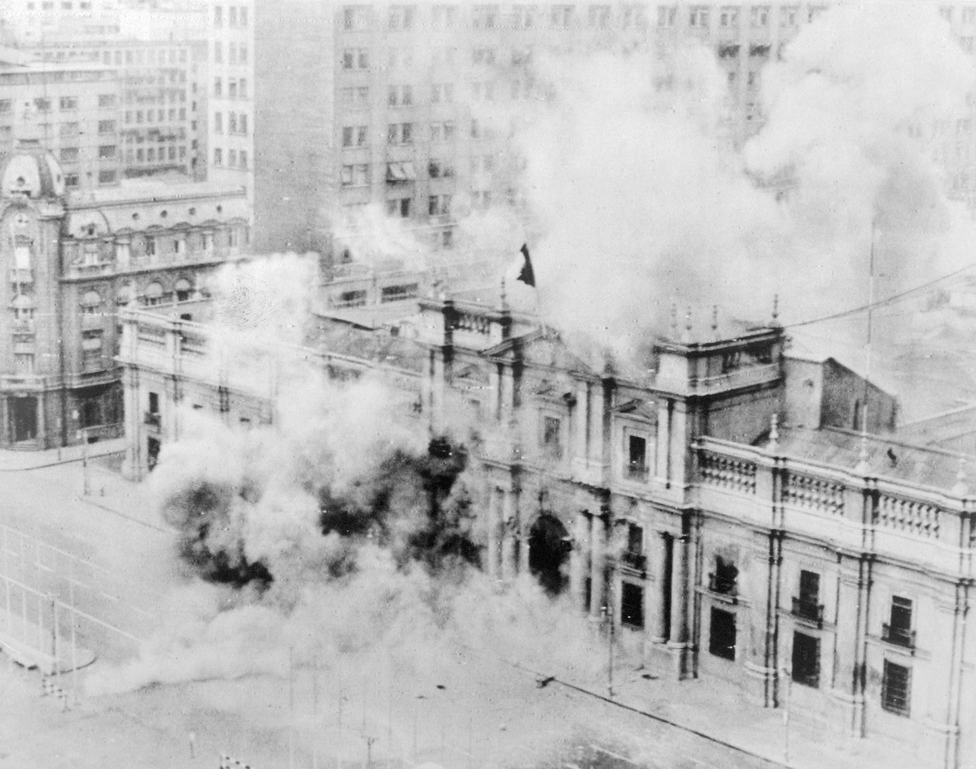 La Moneda, Chile's presidential palace in Santiago, is bombed by the nation's armed forces on September 11, 1973. Salvador Allende, the country's democratically elected socialist president, died during the U.S.-backed coup that brought to power Augusto Pinochet, who imposed neoliberalism through military dictatorship. (Photo: Bettmann via Getty Images)