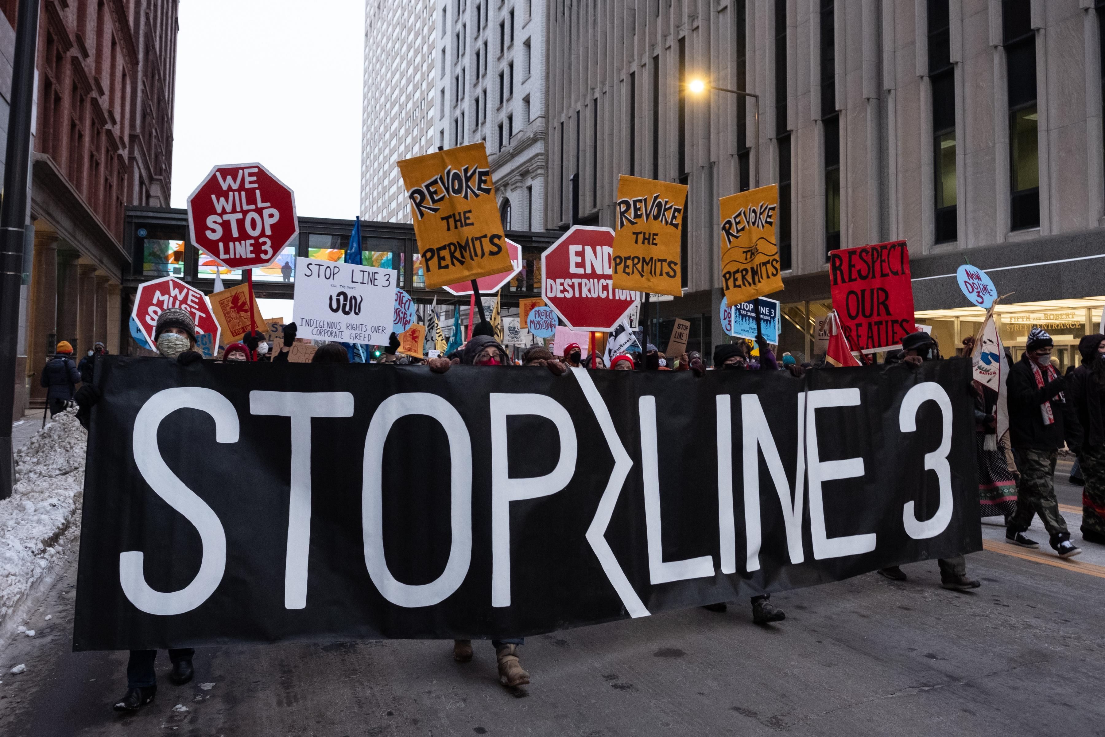 Demonstrators march through downtown St. Paul, Minnesota with a Stop Line 3 banner on January 29, 2021. (Photo: Tim Evans/NurPhoto via Getty Images)
